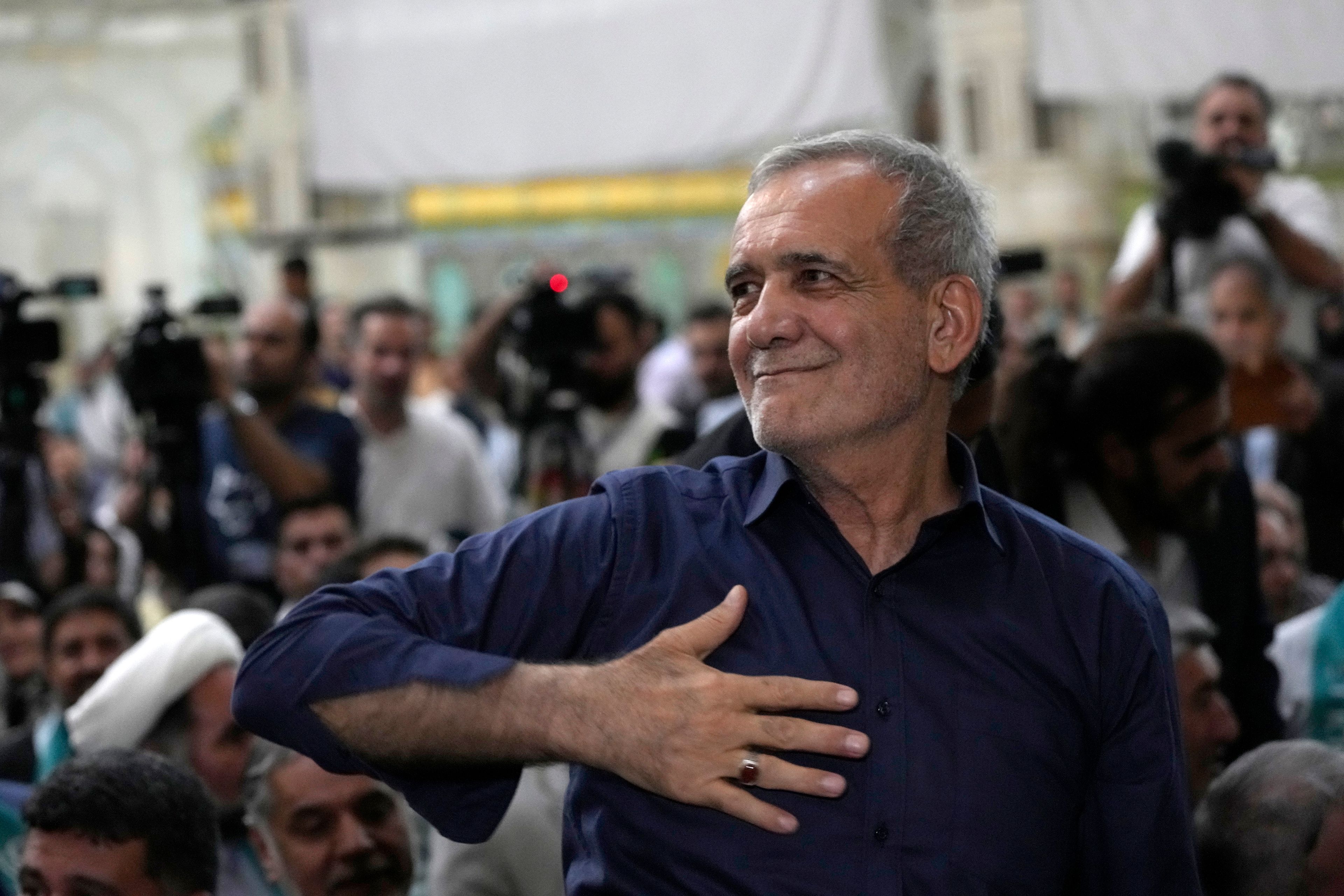 Iran's President-elect Masoud Pezeshkian greets his supporters in a meeting a day after the presidential election, at the shrine of the late revolutionary founder Ayatollah Khomeini, just outside Tehran, Iran, Saturday, July 6, 2024. (AP Photo/Vahid Salemi)