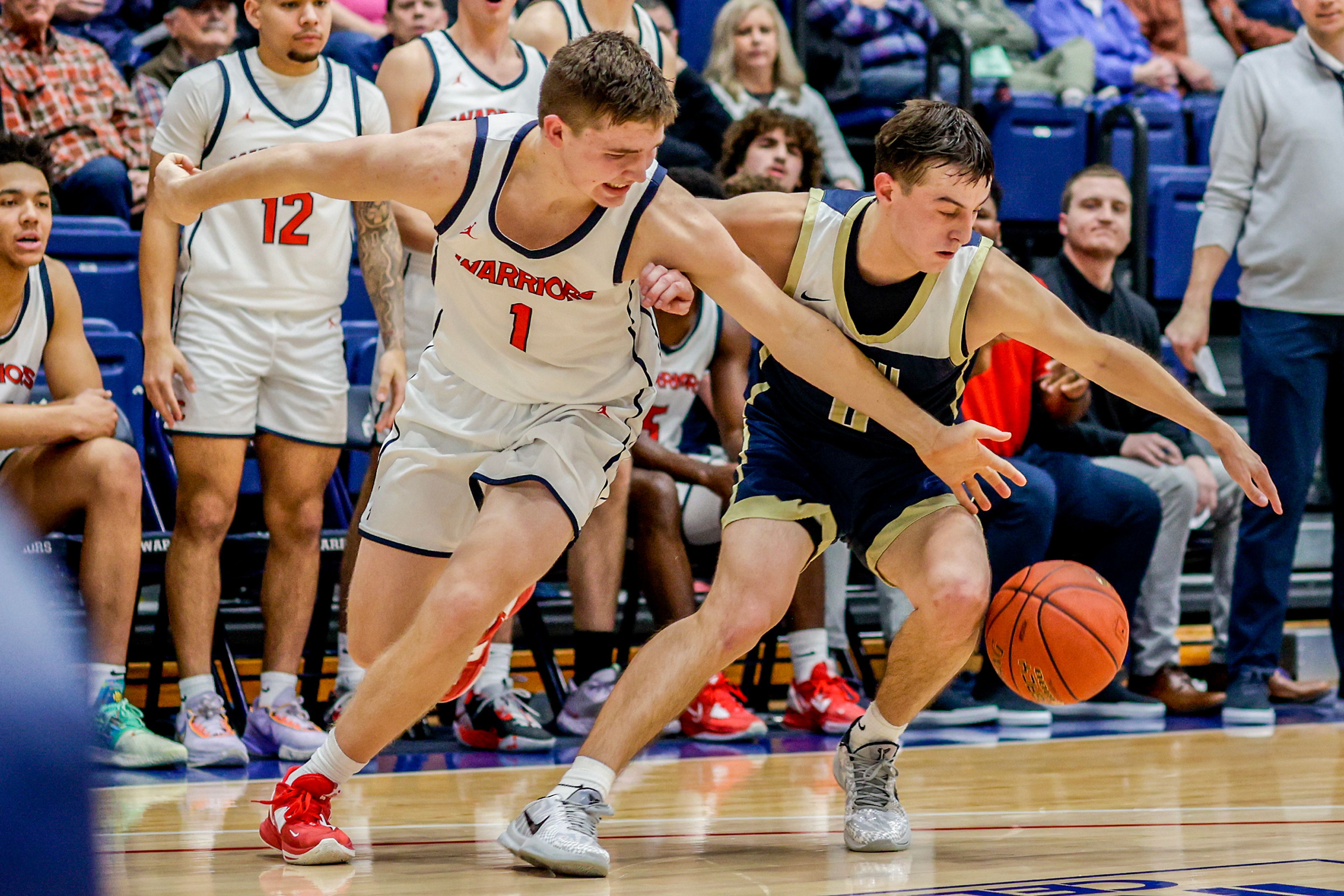 Lewis-Clark State guard John Lustig has the ball stolen from him by Eastern Oregon guard Phillip Malatare during a Cascade Conference game Friday at Lewis-Clark State College.