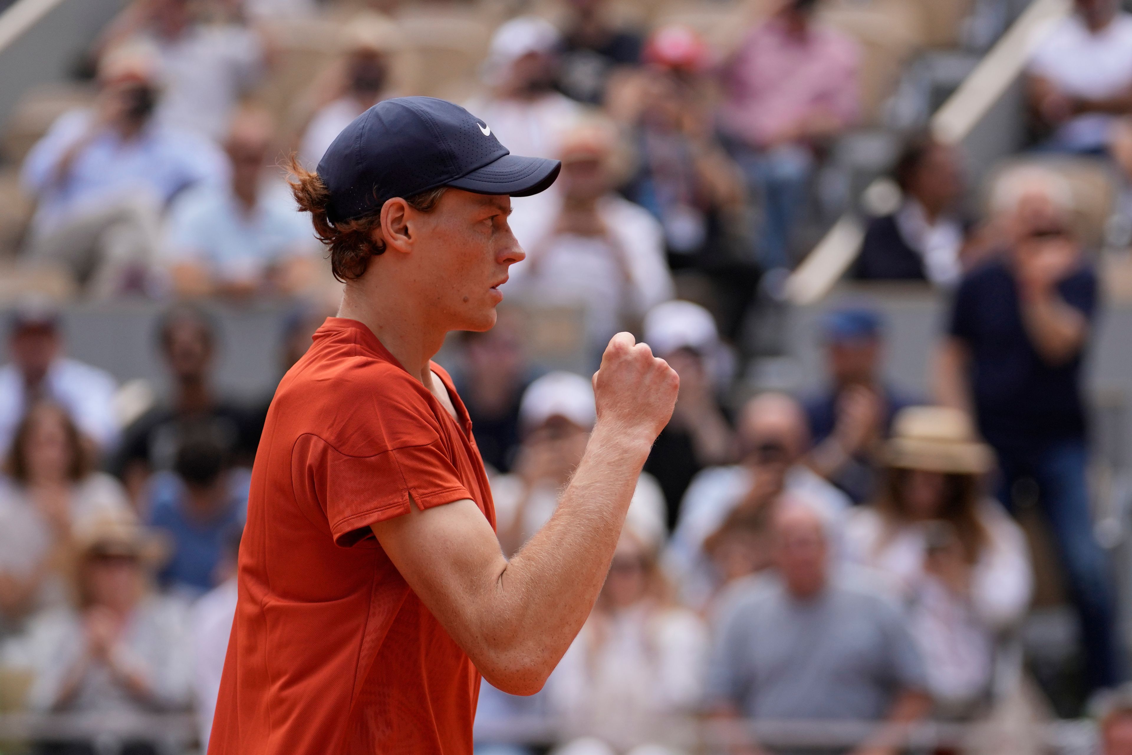 Italy's Jannik Sinner celebrates as he won the quarterfinal match of the French Open tennis tournament against Bulgaria's Grigor Dimitrov at the Roland Garros stadium in Paris, Tuesday, June 4, 2024.