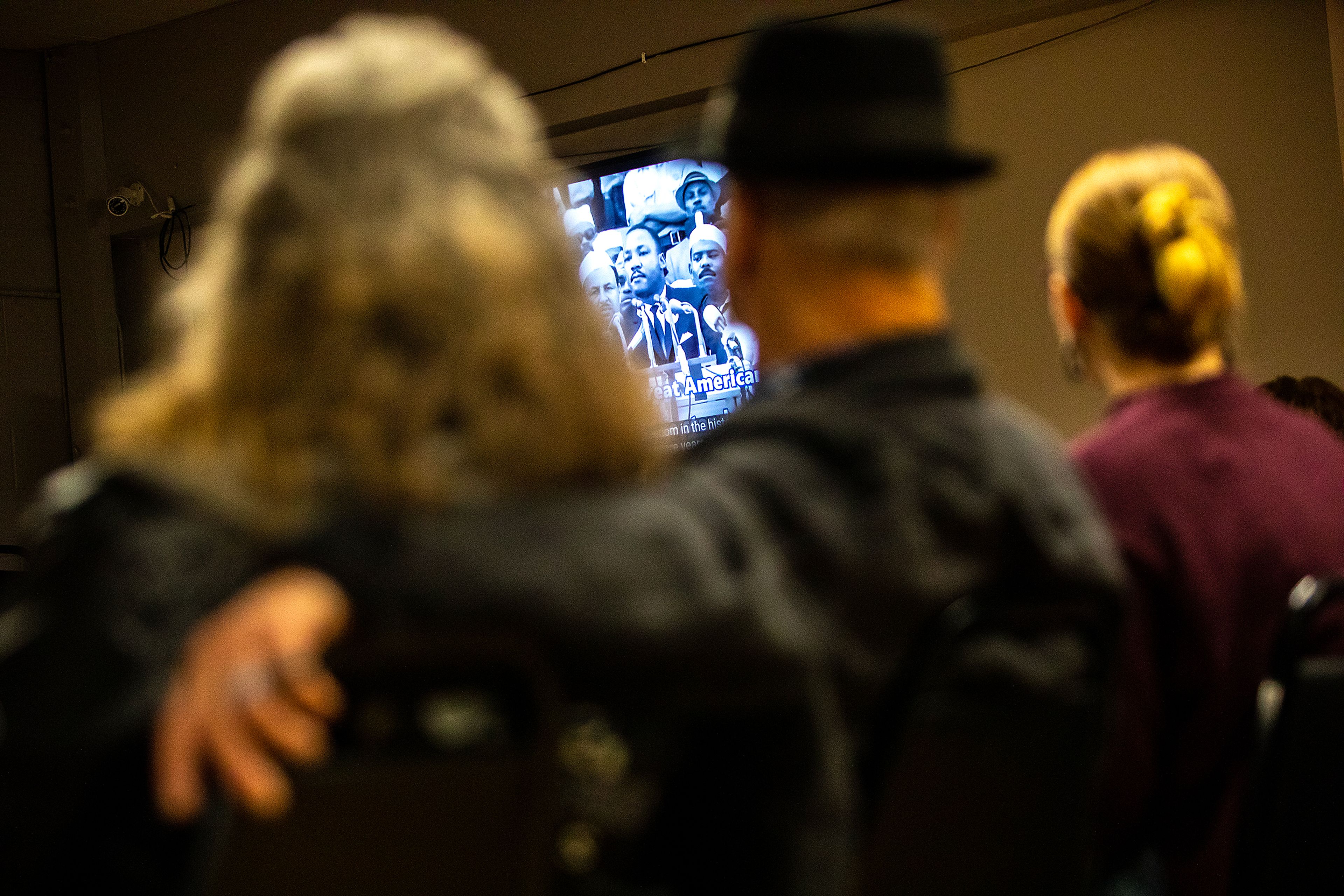 People watch a video of Martin Luther King Jr.’s “I Have a Dream” speech during the YWCA Martin Luther King Jr. Day event Monday in Lewiston.