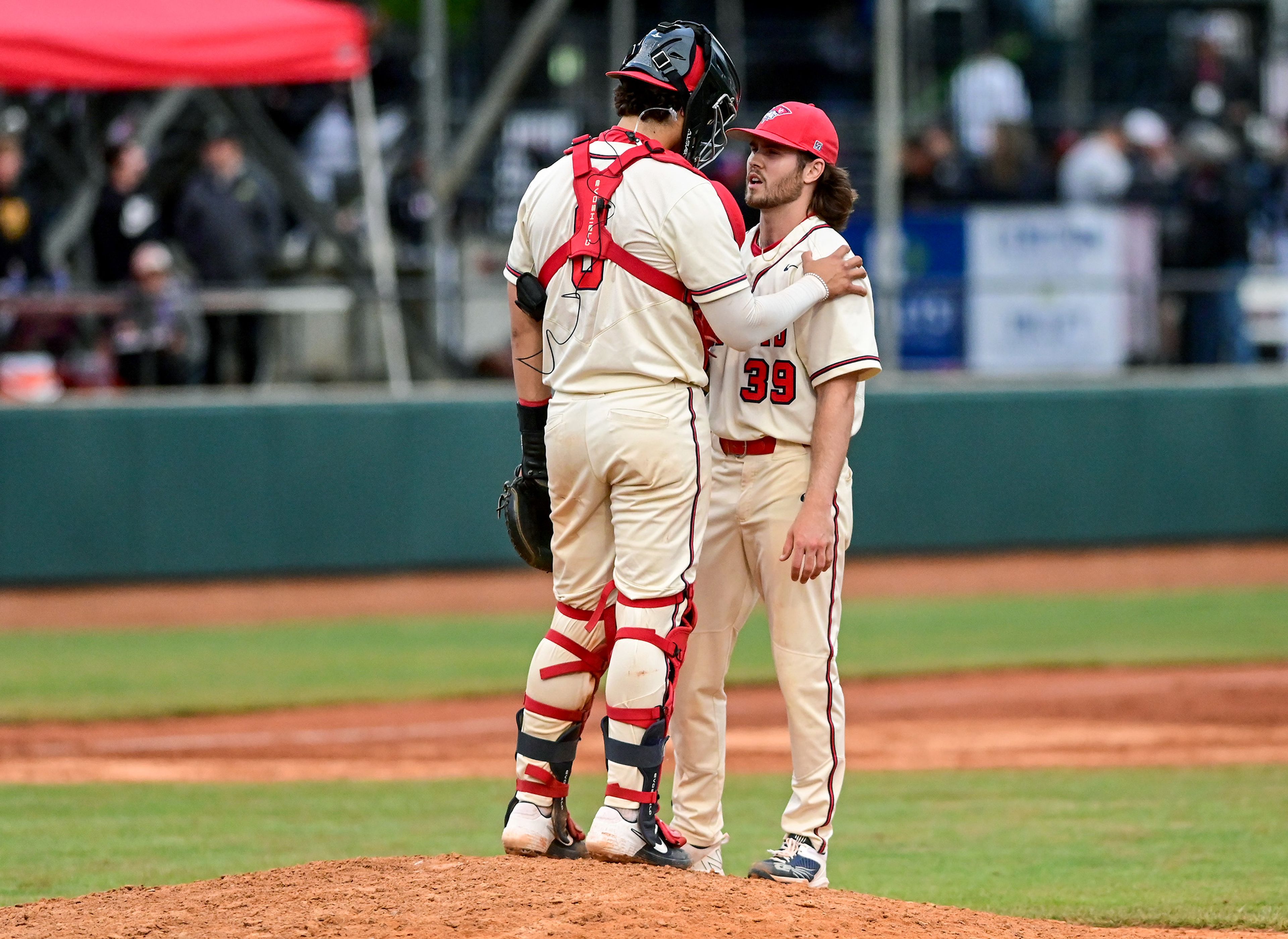 Cumberlands catcher Charlie Muñiz and pitcher Cooper Morgan talk on the mound during a game against Tennessee Wesleyan on the opening day of the NAIA World Series at Harris Field in Lewiston on Friday.