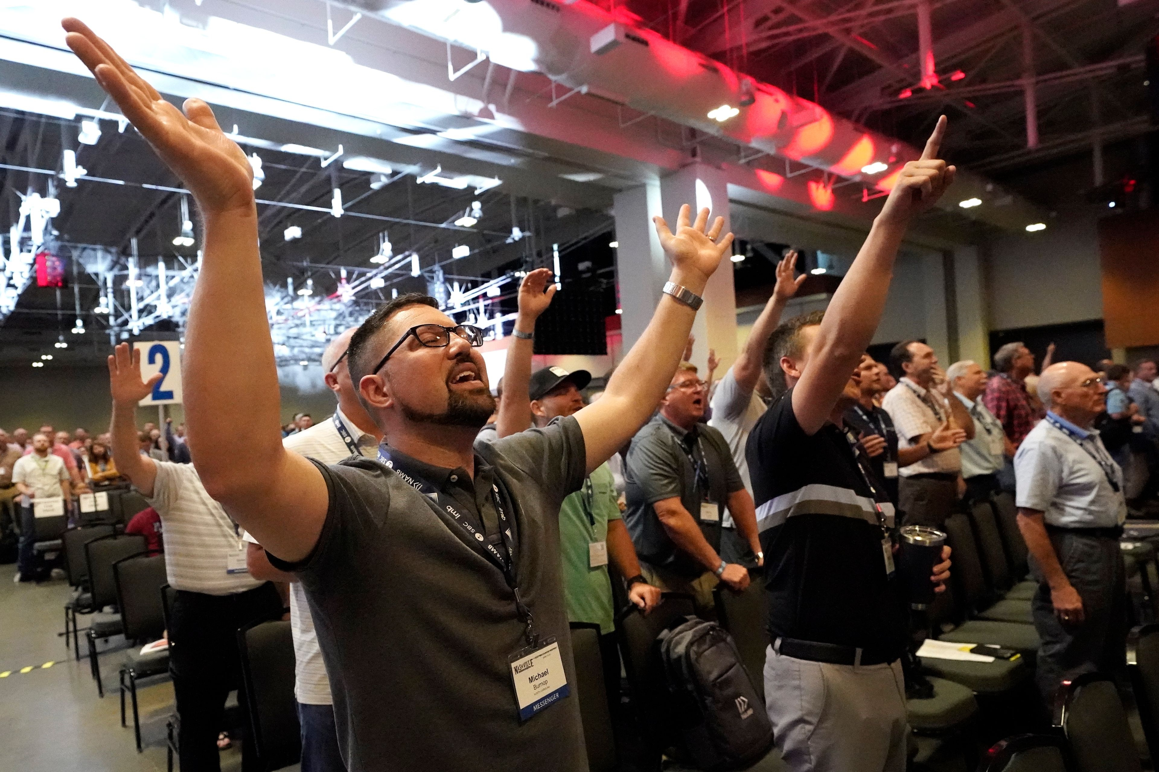 FILE - People take part in a worship service during the annual Southern Baptist Convention meeting Tuesday, June 15, 2021, in Nashville, Tenn. Southern Baptists gathering at their next annual meeting June 11-12, 2024, in Indianapolis will vote on whether to enact a constitutional ban on churches with women pastors.