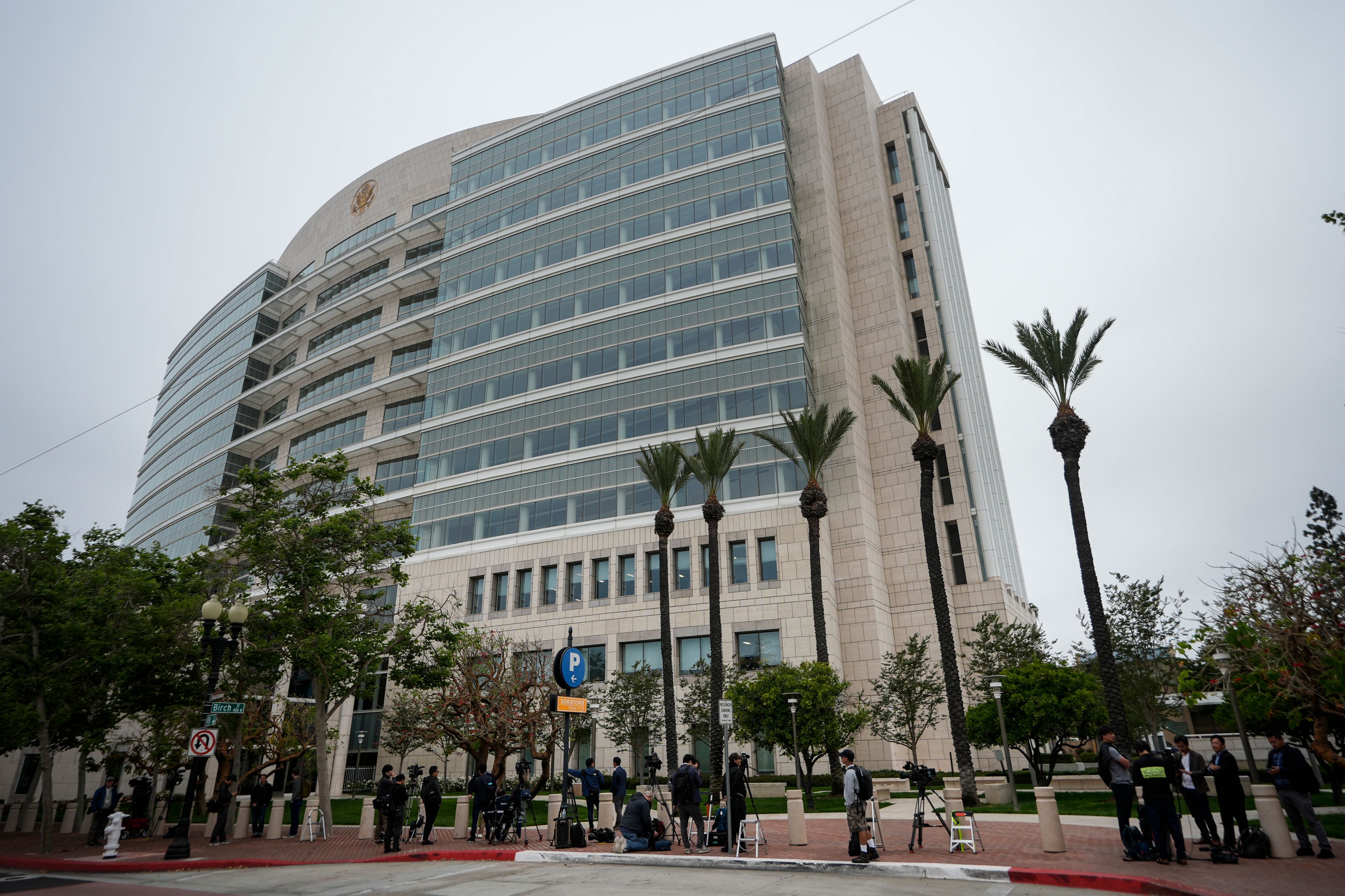 Members of the media wait for the arrival of Ippei Mizuhara, the former interpreter for the Los Angeles Dodgers baseball star Shohei Ohtani, outside federal court in Los Angeles, Tuesday, June 4, 2024. Mizuhara is scheduled to plead guilty Tuesday to bank and tax fraud in a sports betting case where he is expected to admit to stealing nearly $17 million from the Japanese baseball player.