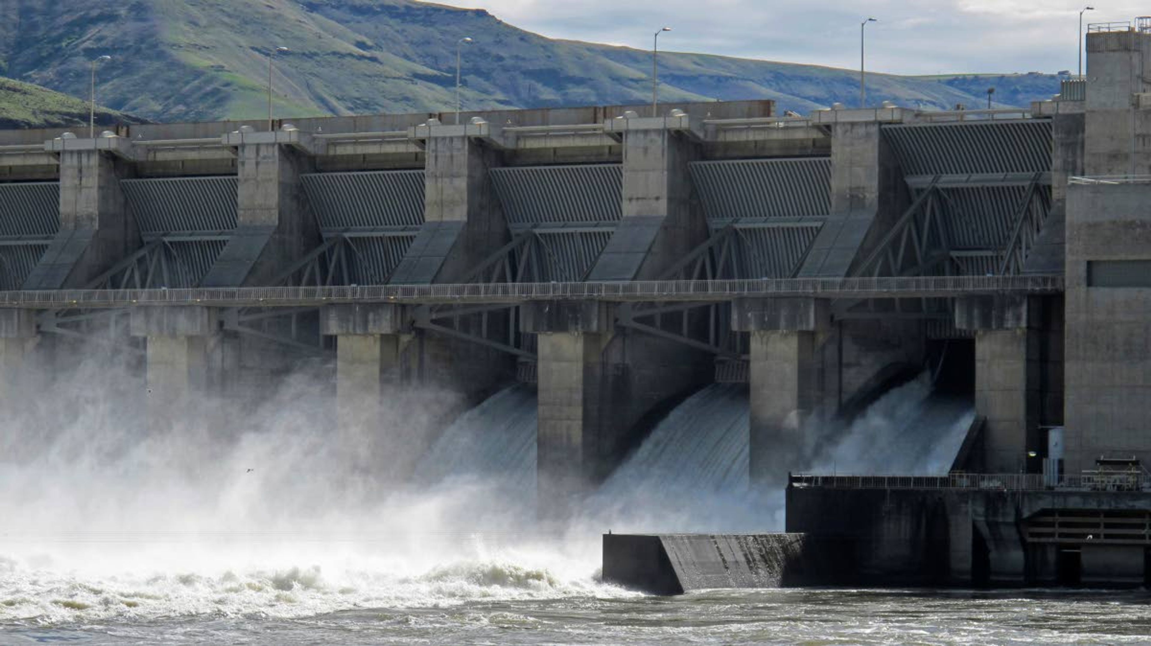 This April 11, 2018, file photo shows water moving through a spillway of the Lower Granite Dam on the Snake River near Almota, Wash.