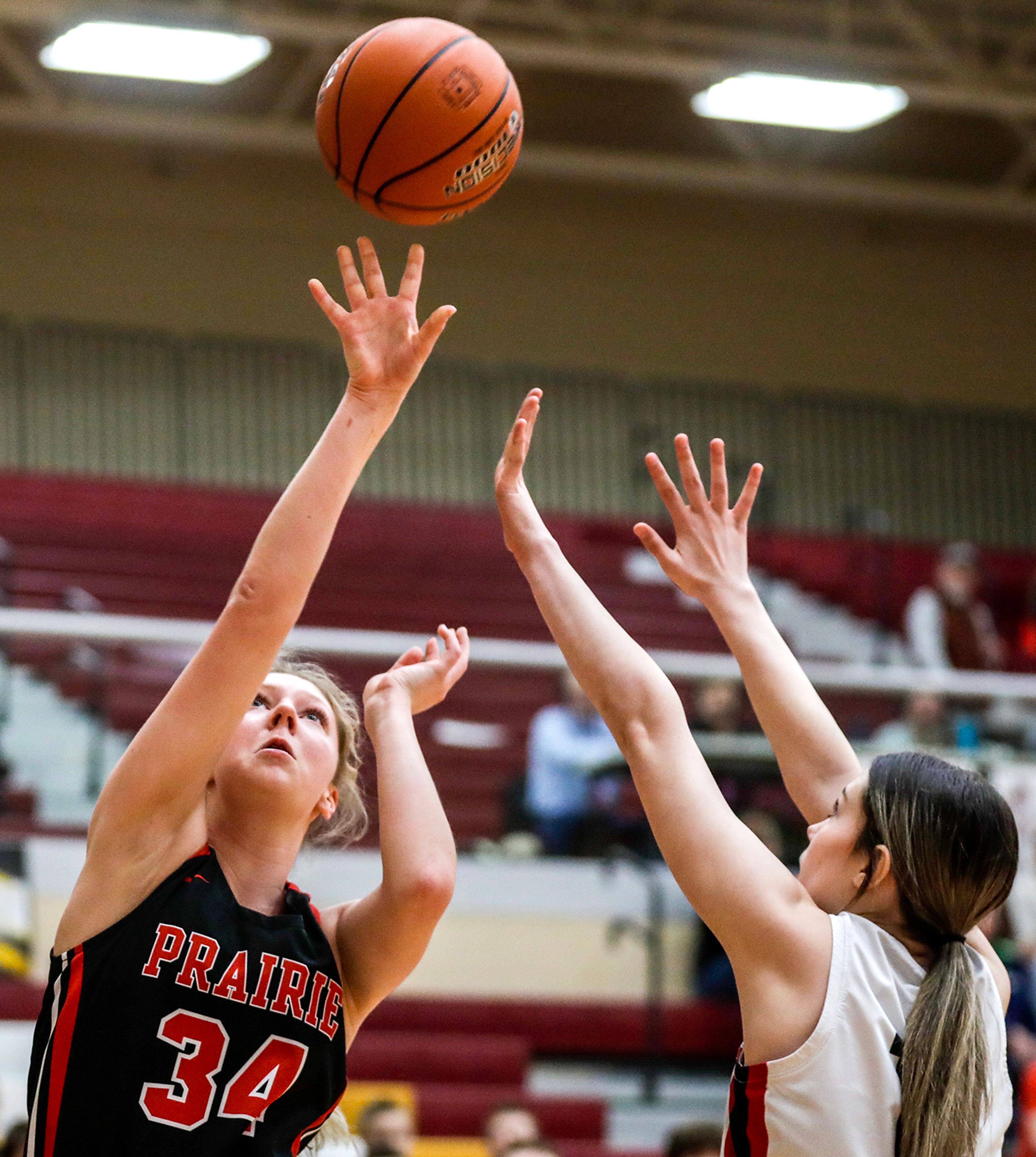 Prairie post Kylie Schumacher shoots a layup over Murtaugh forward Bristyl Perkins during a quarterfinal game in the girls 1A DI state tournament Thursday at Columbia High School in Nampa.