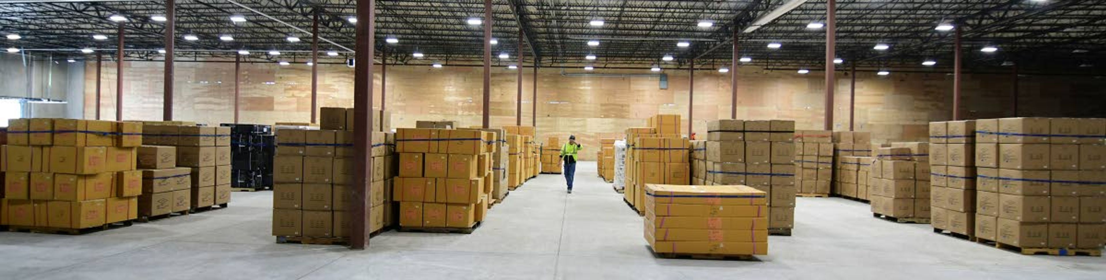 A man walks through the Northwest River Supplies warehouse in Moscow. The building is being expanded so that the business can house all of its Moscow operations at a single location.