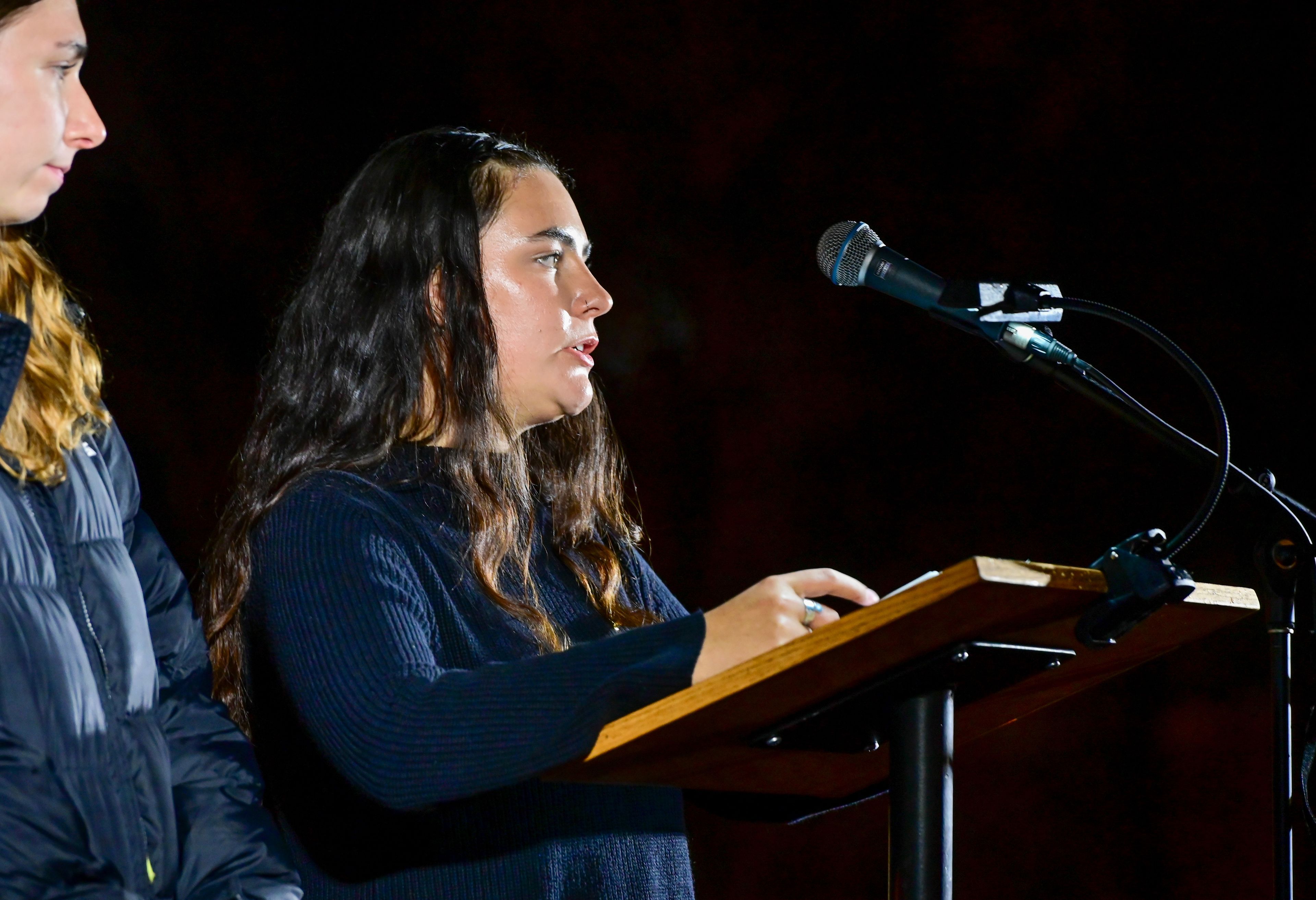 Heather Blaschka, right, on Monday speaks fondly of the memories shared with friend Madison Mogen, one of the four University of Idaho students killed a year ago in Moscow, during a vigil held in honor of those students a year after their death on campus.