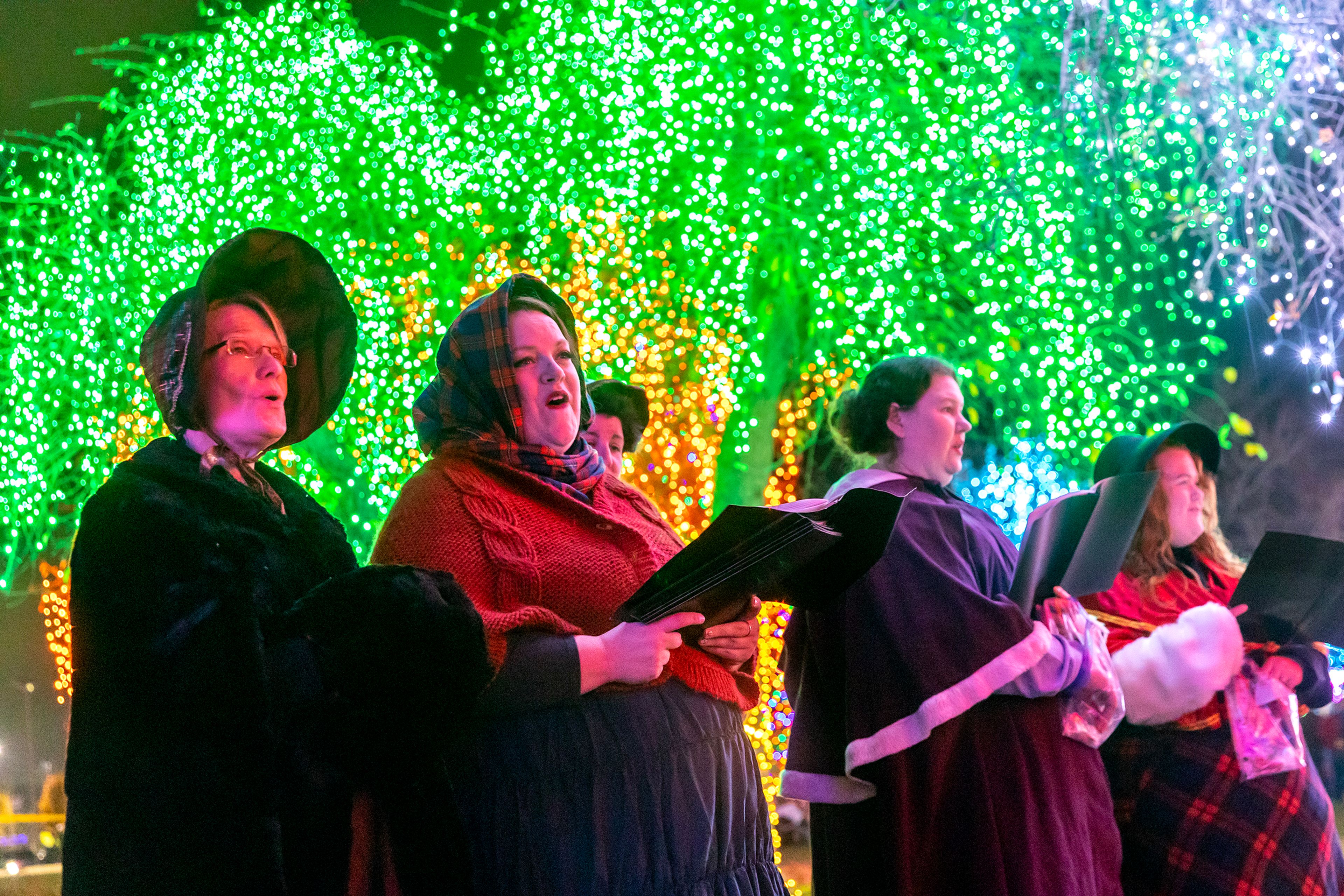 Carolers sing at the Winter Spirit Holiday Light Display Saturday at Locomotive Park in Lewiston.