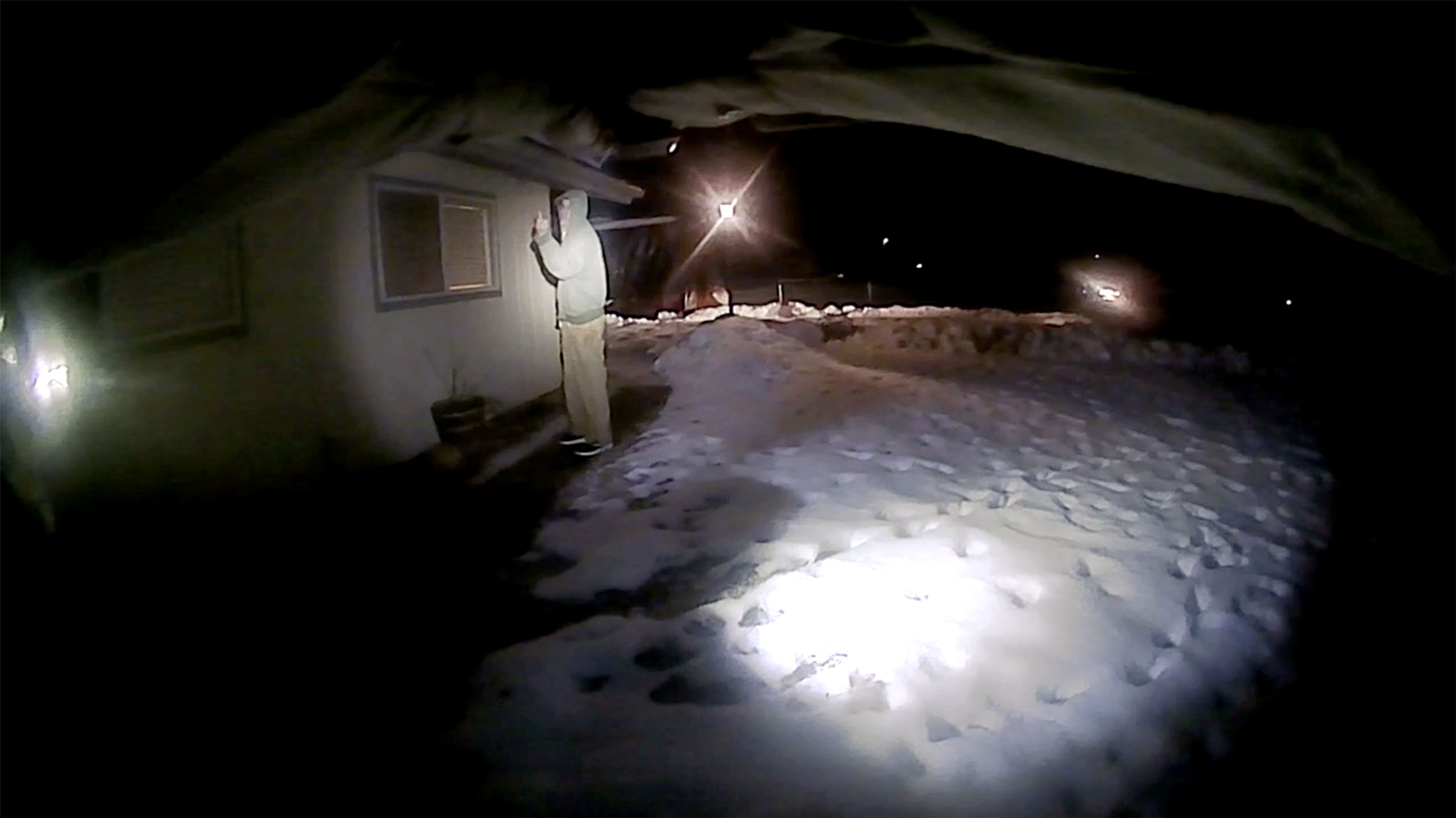 Michael J. Trappett gestures toward Clearwater County Sheriff's Office deputies in this image taken from an officer's body camera footage. Moments after this image, Trappett was shot and killed by the officers after turning toward them with the knife held up in his right hand.