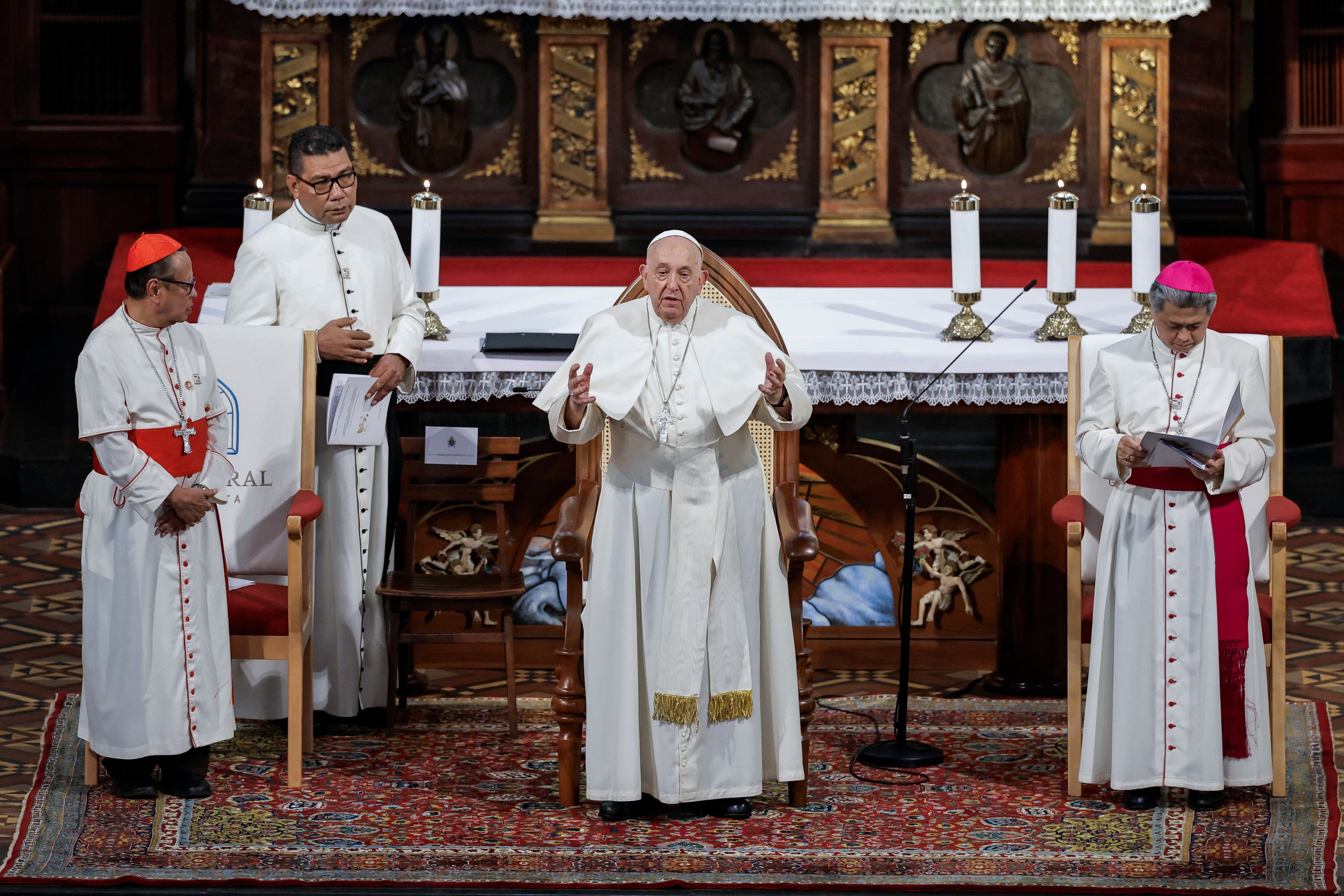 Pope Francis, center, speaks to members of the Catholic community at the Jakarta Cathedral in Jakarta, Indonesia, Wednesday, Sept. 4, 2024.