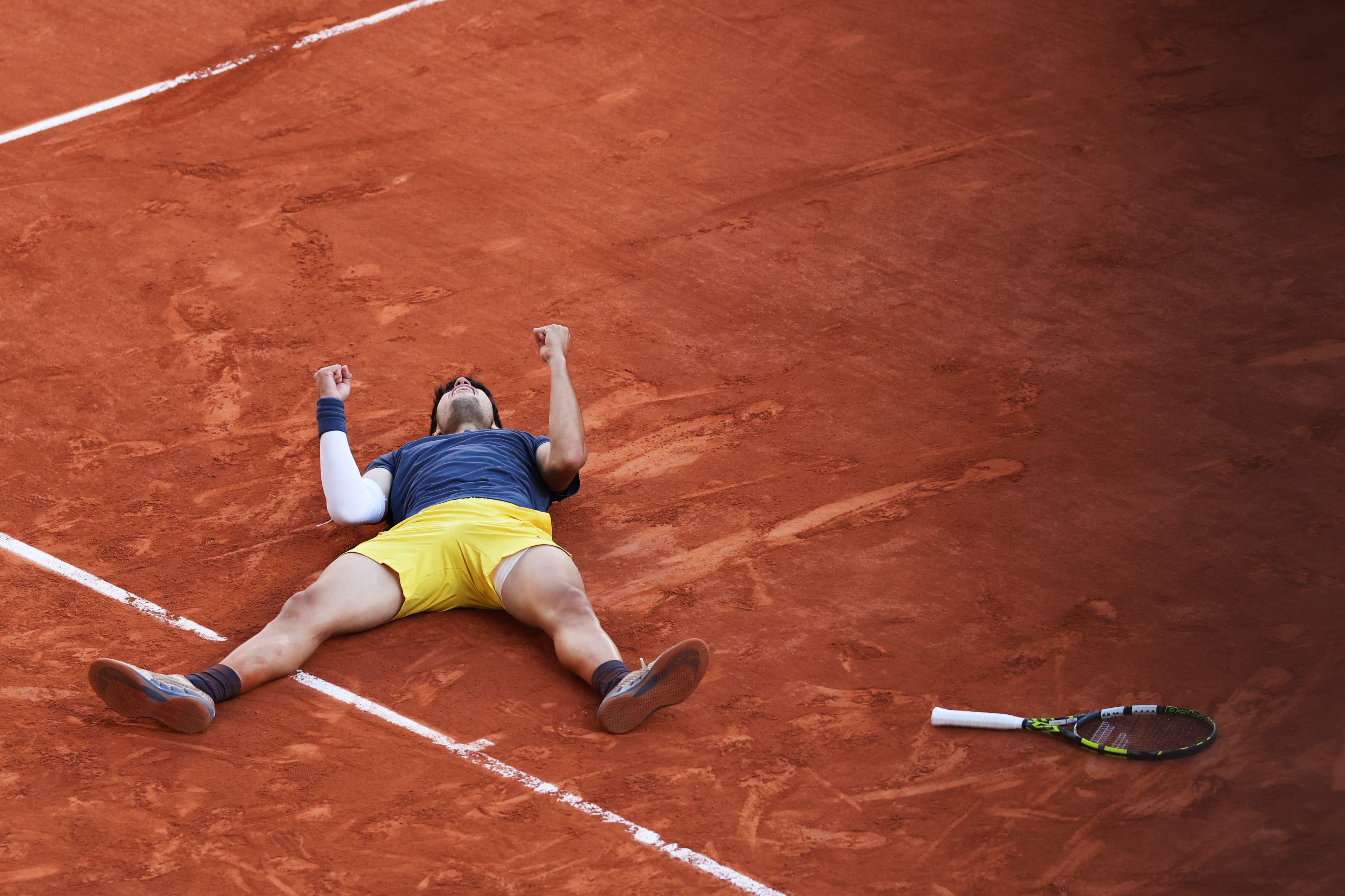 Spain's Carlos Alcaraz celebrates as he won the men's final match of the French Open tennis tournament against Germany's Alexander Zverev at the Roland Garros stadium in Paris, Sunday, June 9, 2024.