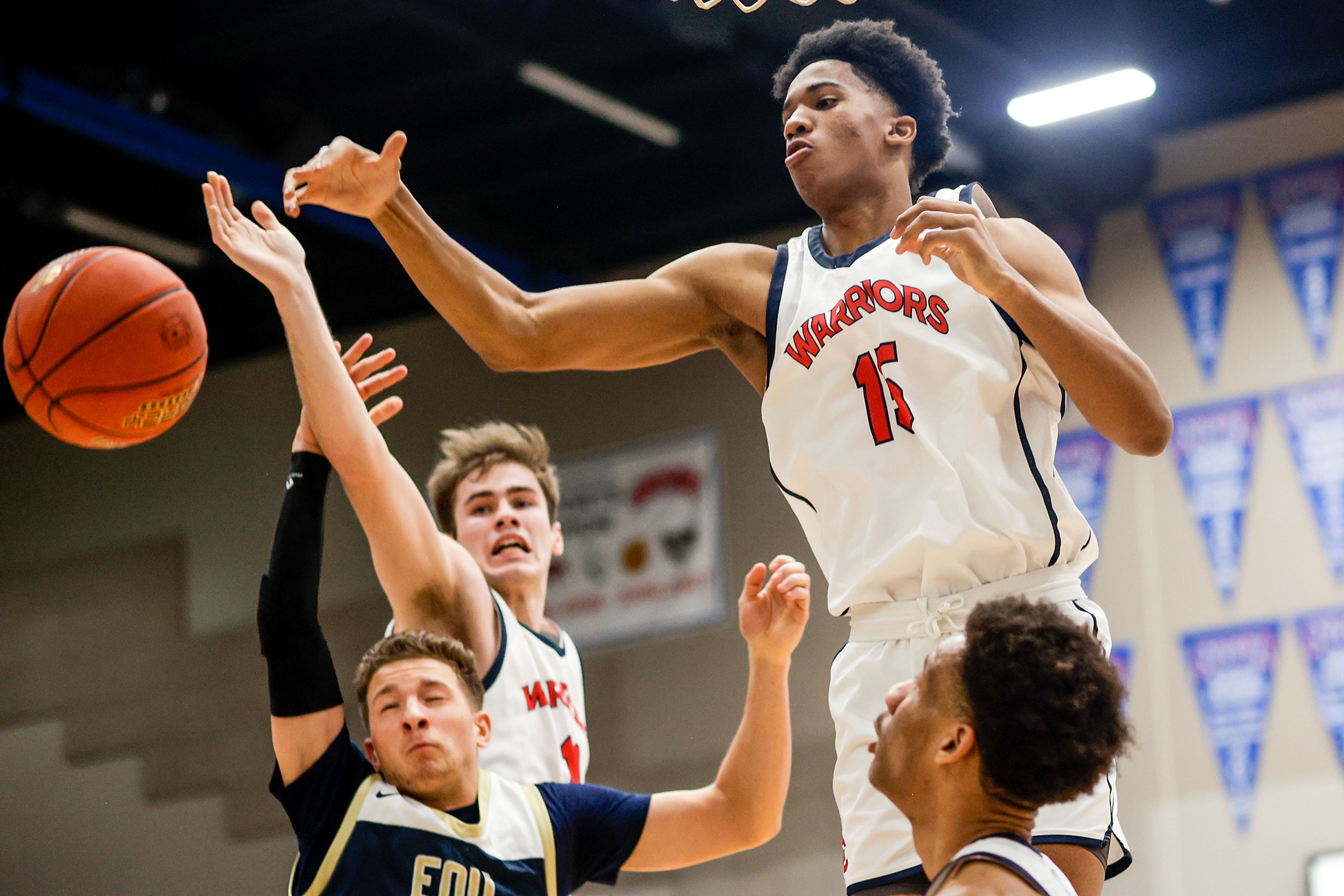 Lewis-Clark State forward Anthony Peoples Jr., right, competes for the rebound during Friday's Cascade Conference game against Eastern Oregon at Lewis-Clark State College.