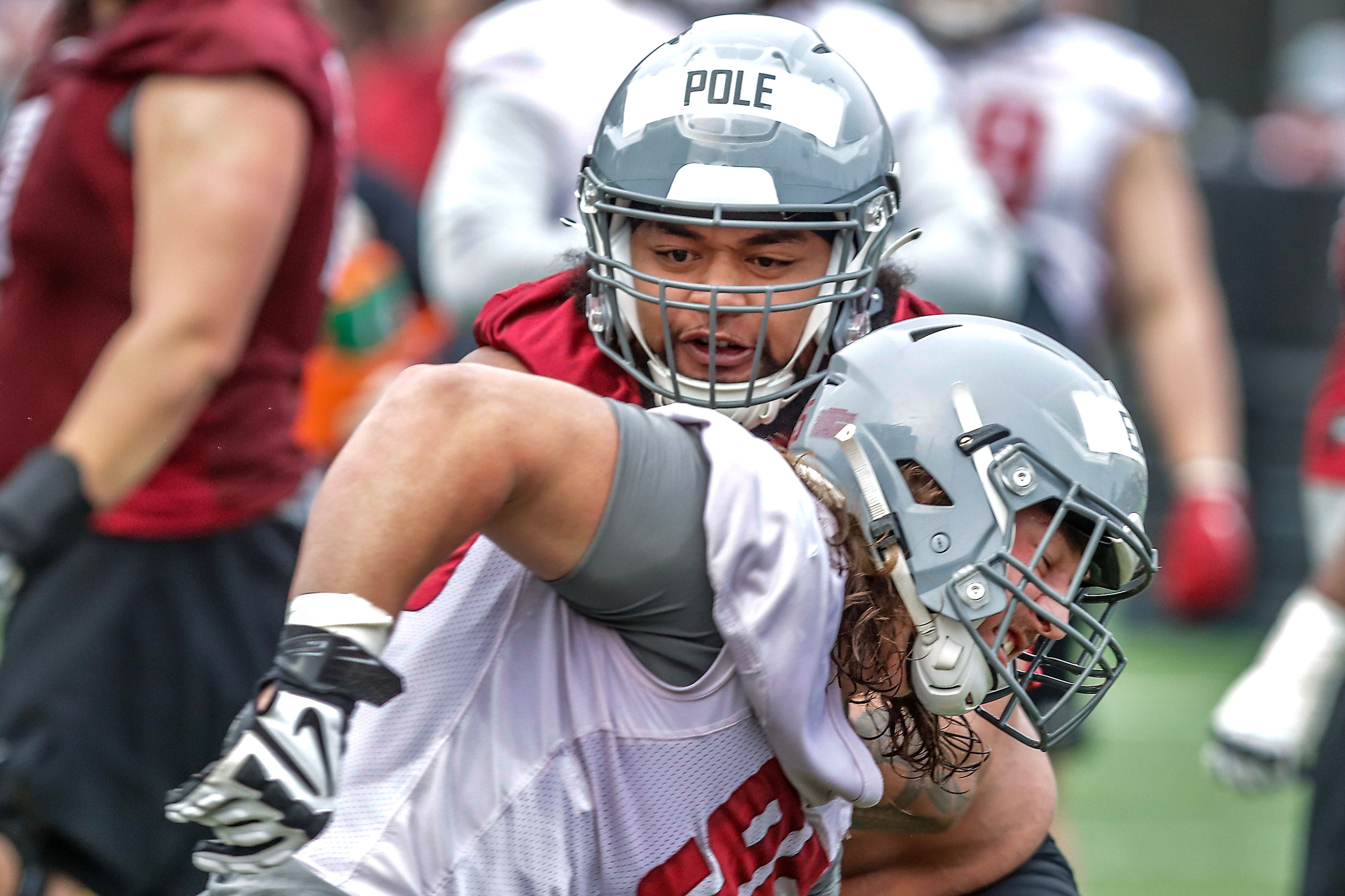 Offensive lineman Esa Pole tries to stop edge Andrew Edson during Washington State footballs first spring practice of the 2023 season on March 21, 2023 in Pullman.