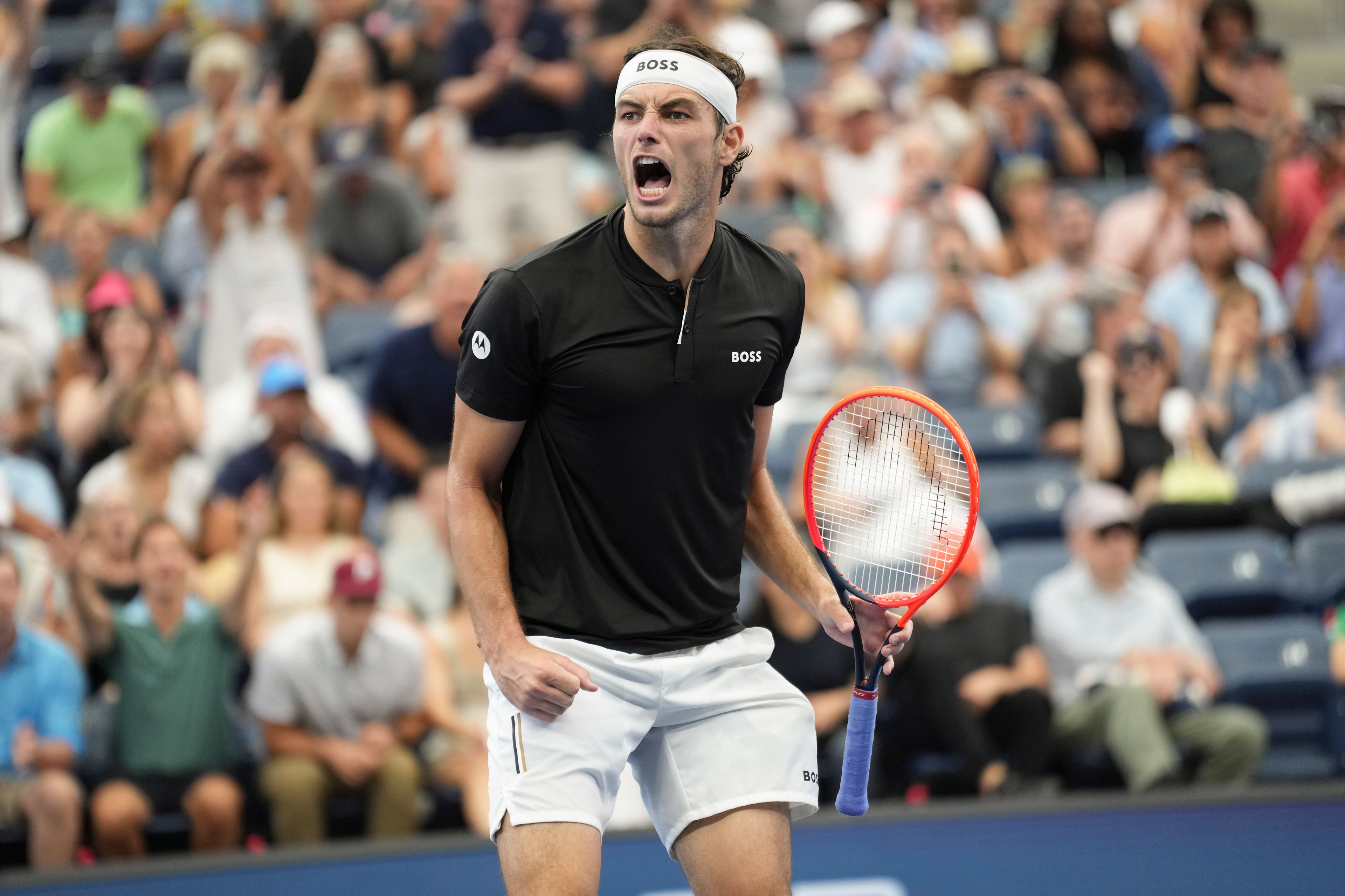 Taylor Fritz, of the United States, reacts after defeating Casper Ruud, of Norway, during the fourth round of the U.S. Open tennis championships, Sunday, Sept. 1, in New York. 2024.