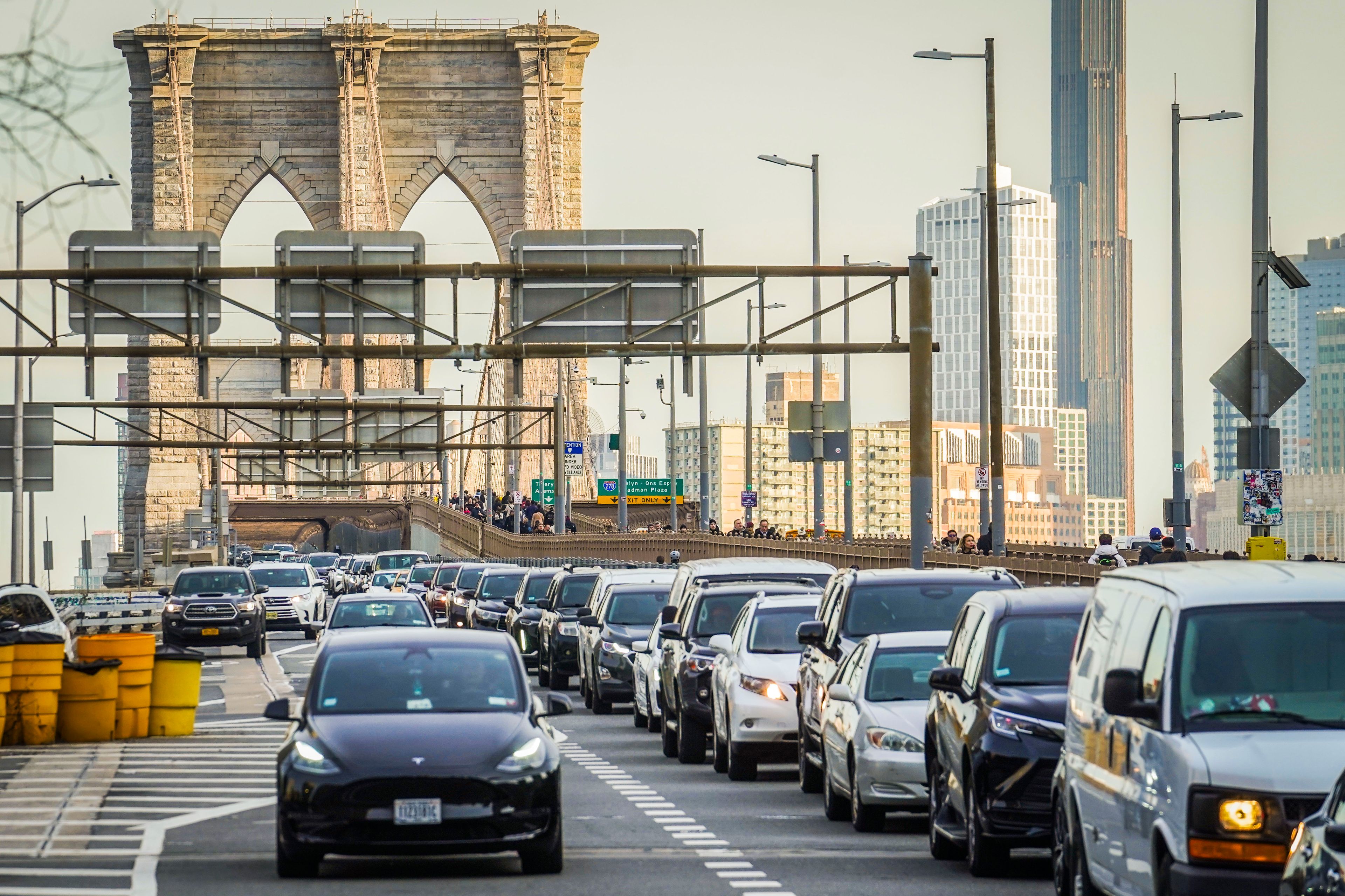 FILE - Traffic enters lower Manhattan after crossing the Brooklyn Bridge, Thursday, Feb. 8, 2024, in New York. New York Gov. Kathy Hochul on Wednesday, June 5, 2024 indefinitely delayed implementation of a plan to charge motorists big tolls to enter the core of Manhattan, just weeks before the nation's first “congestion pricing” system was set to launch.