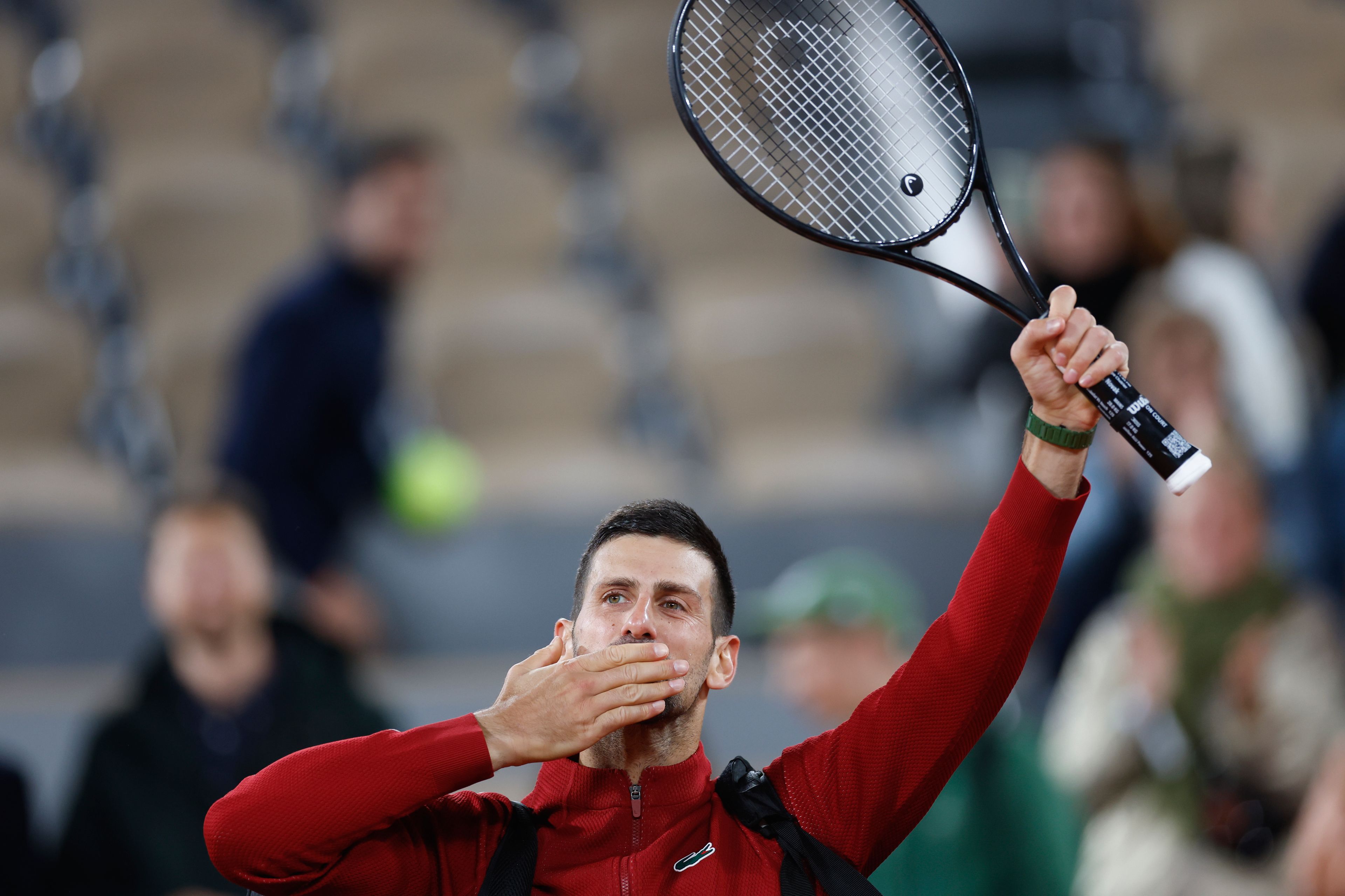 Serbia's Novak Djokovic celebrates winning his third round match of the French Open tennis tournament against Italy's Lorenzo Musetti at the Roland Garros stadium in Paris, Sunday, June 2, 2024.