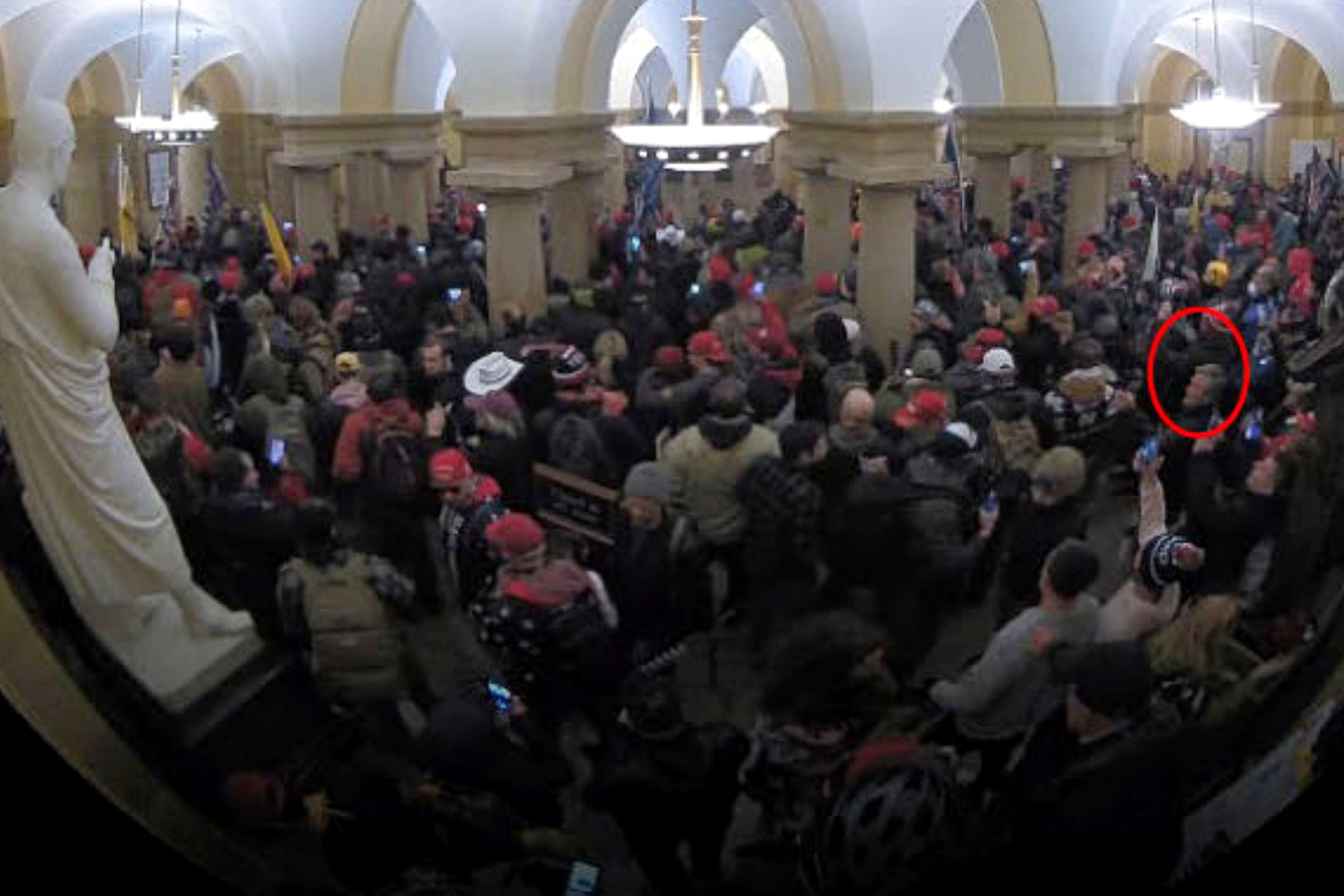 This image from security video of Michael Daniele, a retired New Jersey State Police trooper, seen in the Crypt in the U.S. Capitol on Jan. 6, 2021, was contained in the Justice Department affidavit and complaint in support of the arrest of Daniele. (Department of Justice via AP)