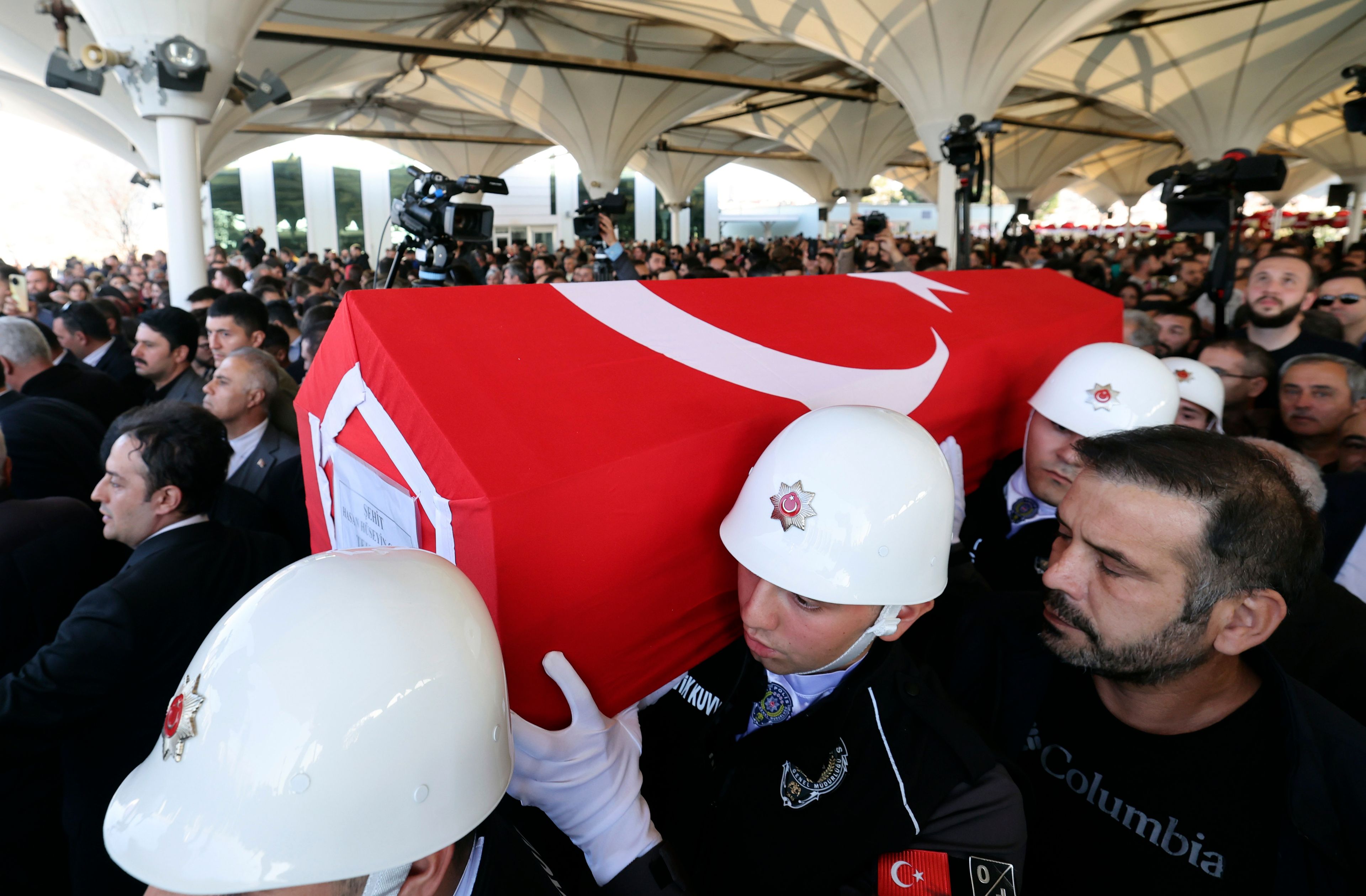 Turkish soldiers carry the coffin of Hasan Huseyin Canbaz, who was killed during an attack by PKK members at the Turkish aerospace and defense company TUSAS on Wednesday, during a funeral at Karsiyaka mosque in Ankara, Turkey, Thursday, Oct. 24, 2024. (Yavuz Ozden/DIA Photo via AP)