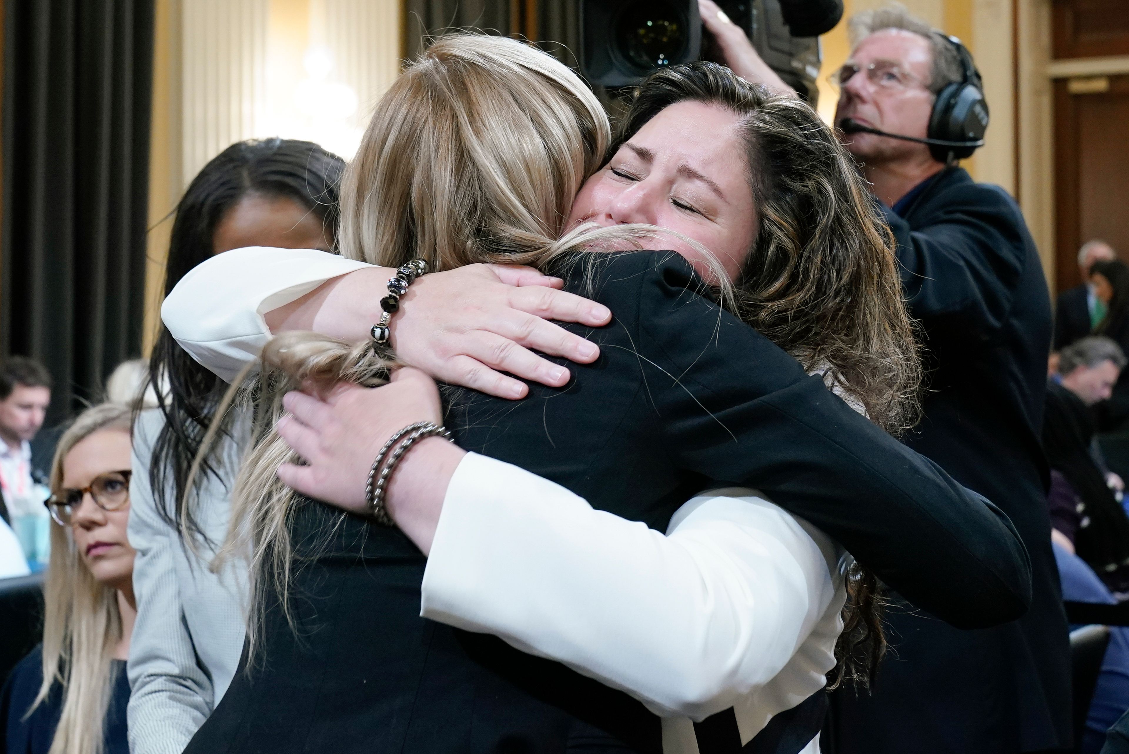 Sandra Garza, right, the longtime partner of fallen Capitol Police Officer Brian Sicknick, hugs U.S. Capitol Police officer Caroline Edwards as they leave after Thursday’s House select committee hearing on the Jan. 6, 2021, attack on the U.S. Capitol.