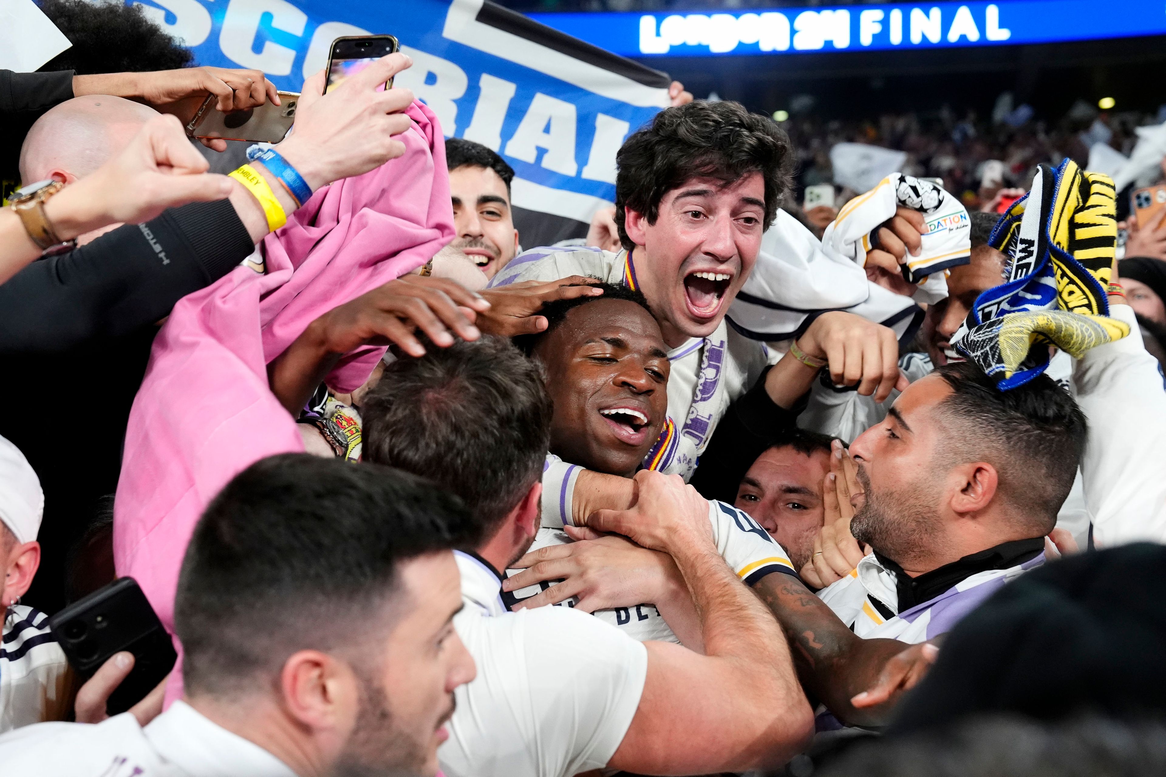 Real Madrid's Vinicius Junior celebrates with the fans after winning the Champions League final soccer match between Borussia Dortmund and Real Madrid at Wembley stadium in London, Saturday, June 1, 2024. Nick Potts/PA via AP)