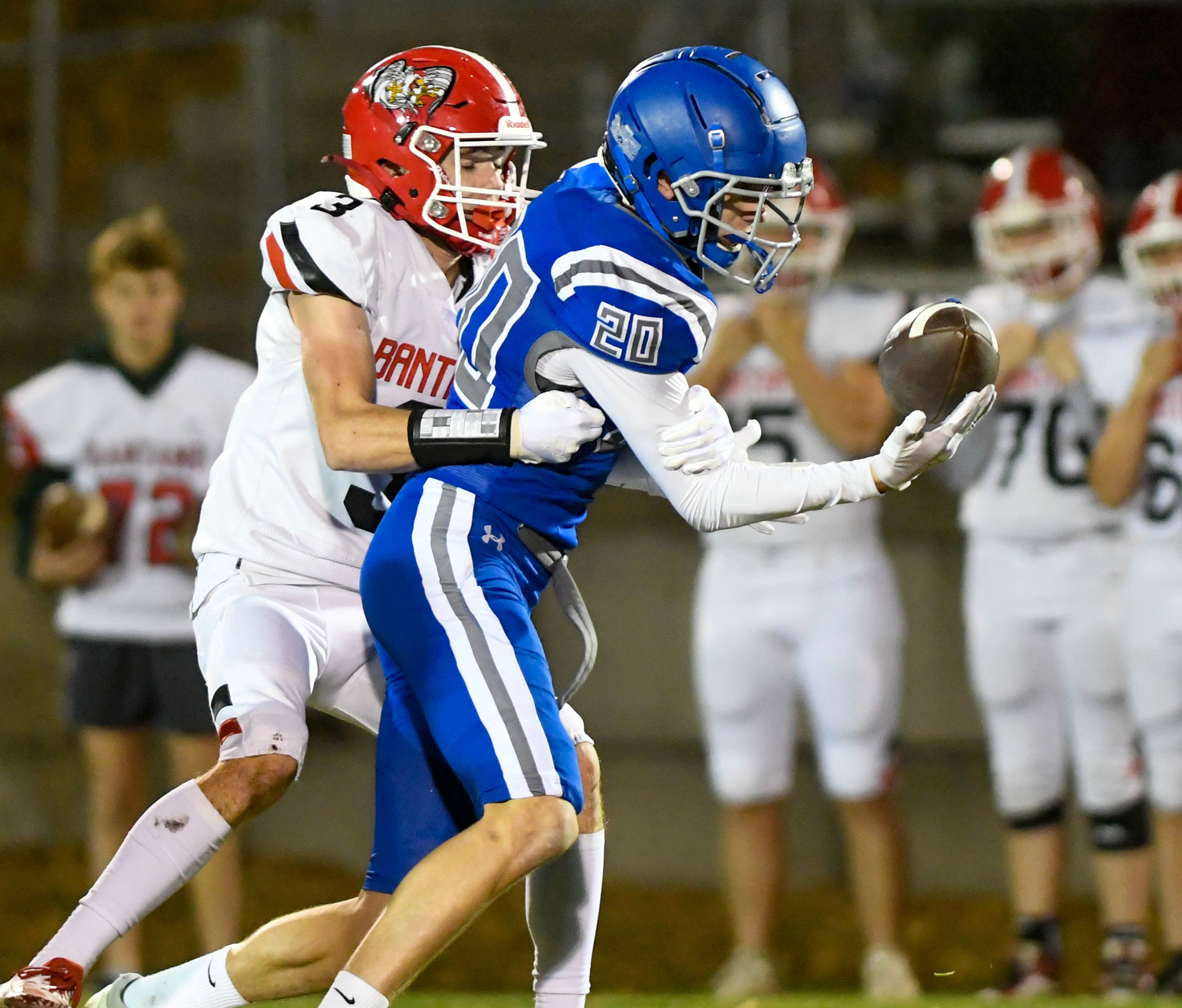 Clarkston�s Luke Siler tackles Pullman�s Will Focht before Focht gains control of a pass Friday in Pullman.,