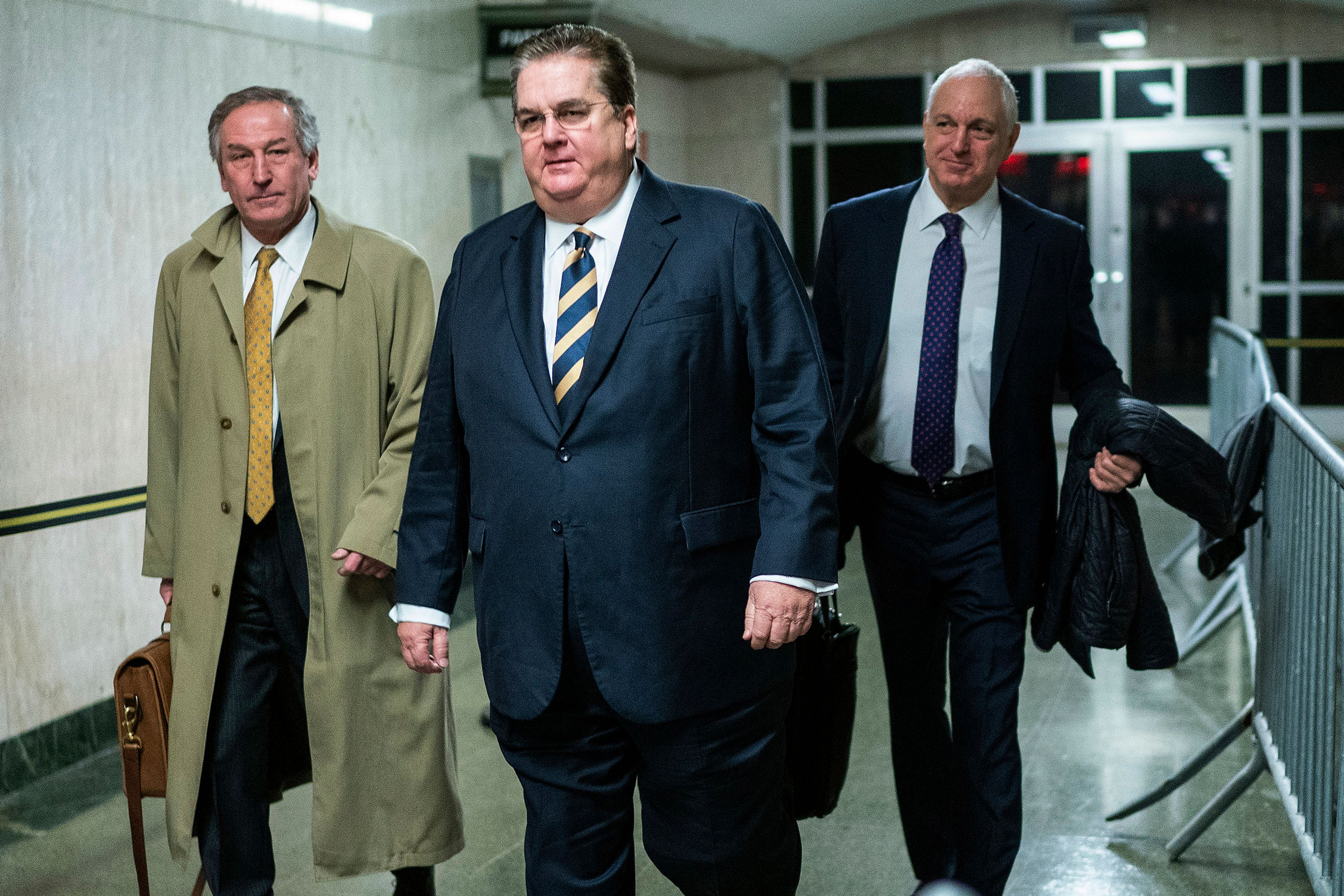 Defense attorneys William Brennan, center and Michael van der Veen, left, exit the courtroom after the sentence day of the Trump Organization tax fraud case, Friday, Jan. 13, 2023, in New York. (AP Photo/Eduardo Munoz Alvarez)