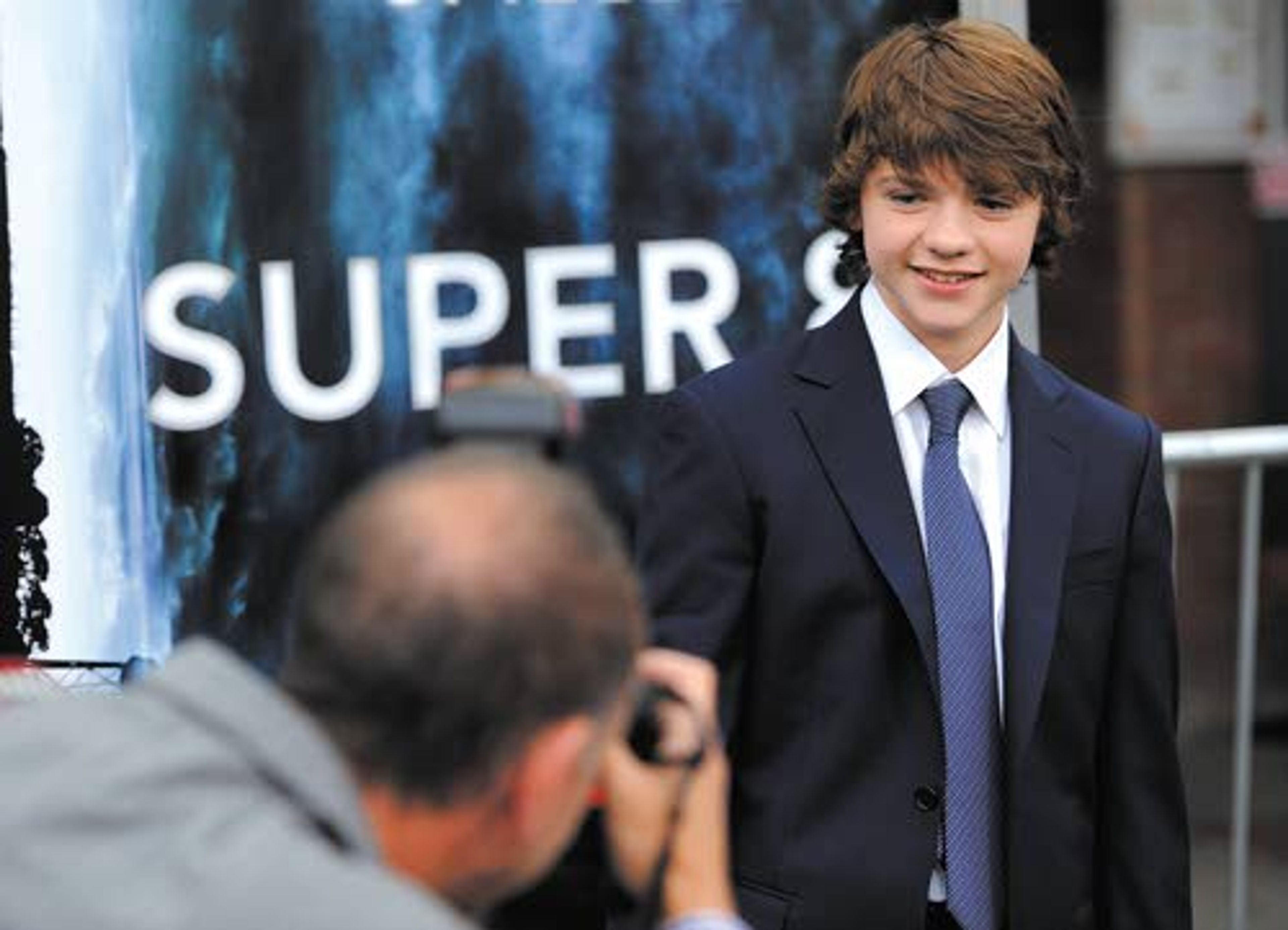 ABOVE: Joel Courtney of Moscow, a cast member in the film “Super
8,” poses for a photographer at the June 8 premiere of the film in
Los Angeles. RIGHT: Courtney is shown portraying his character, Joe
Lamb, in a scene from “Super 8.”