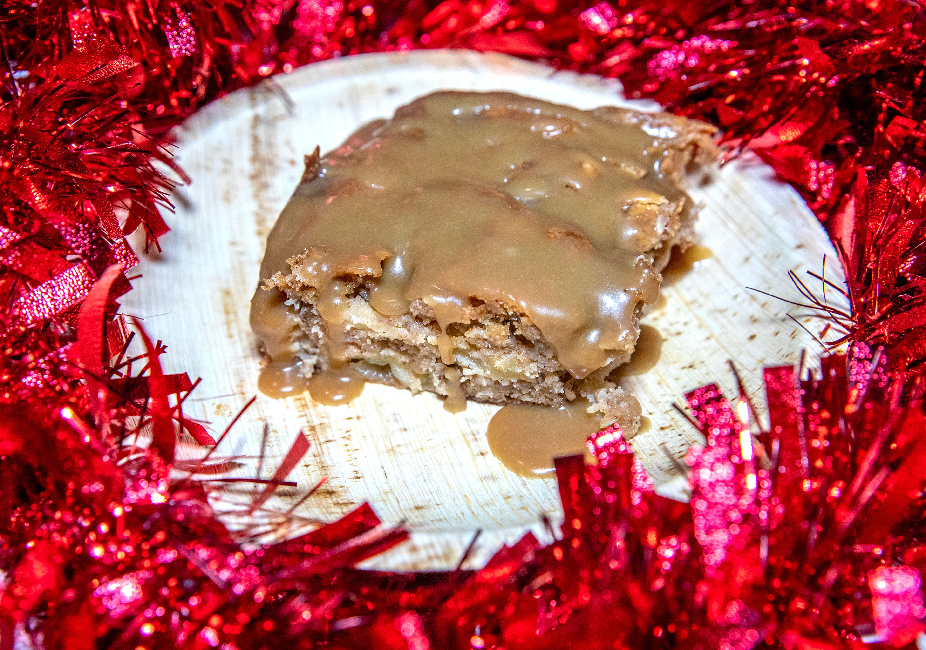 A slice of apple cake with butterscotch syrup is photographed Thursday, Dec. 14, in Lewiston.