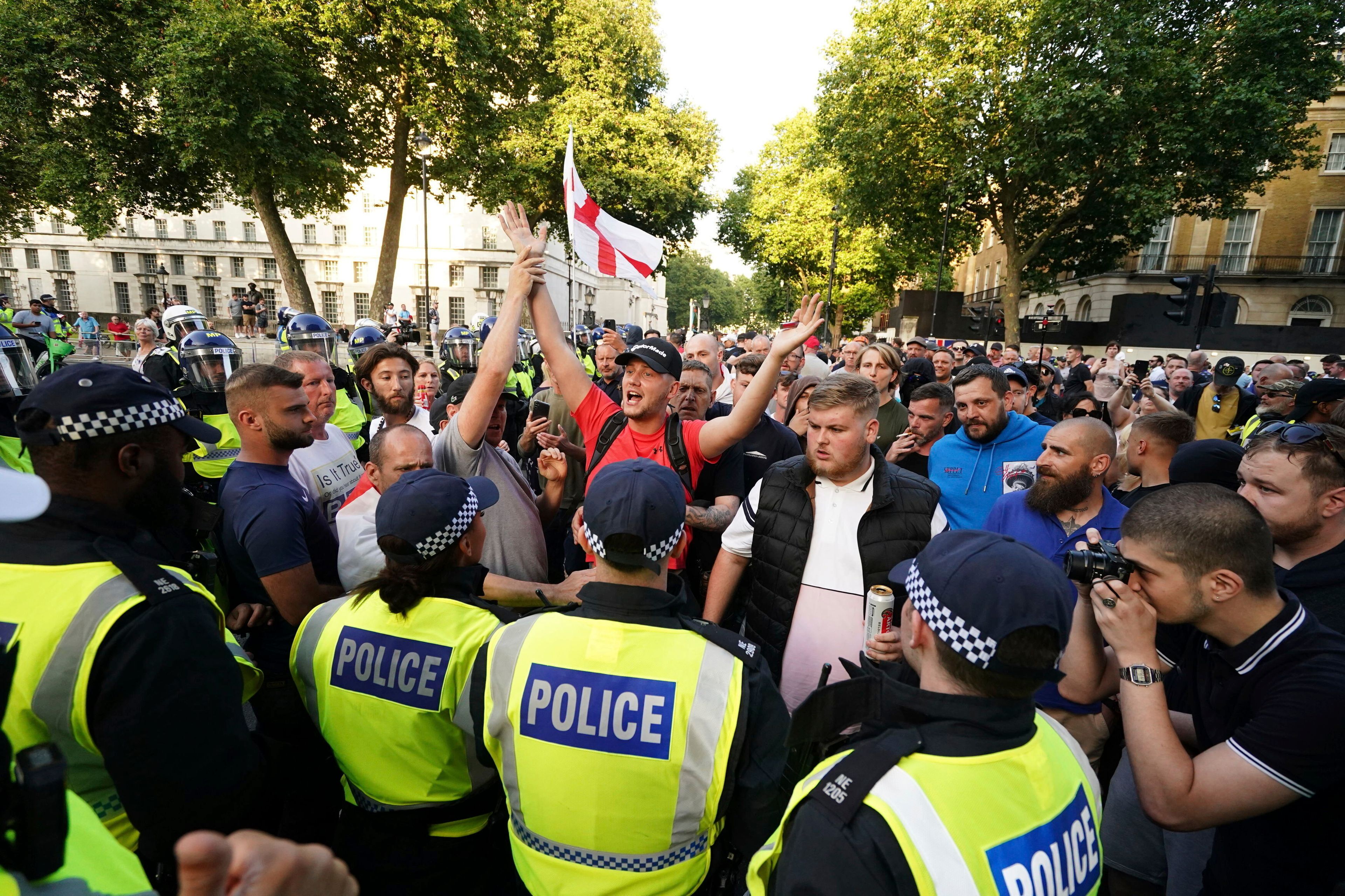 People attend the 'Enough is Enough' protest in Whitehall, London, Wednesday July 31, 2024, following the fatal stabbing of three children at a Taylor Swift-themed holiday club on Monday in Southport. (Jordan Pettitt/PA via AP)