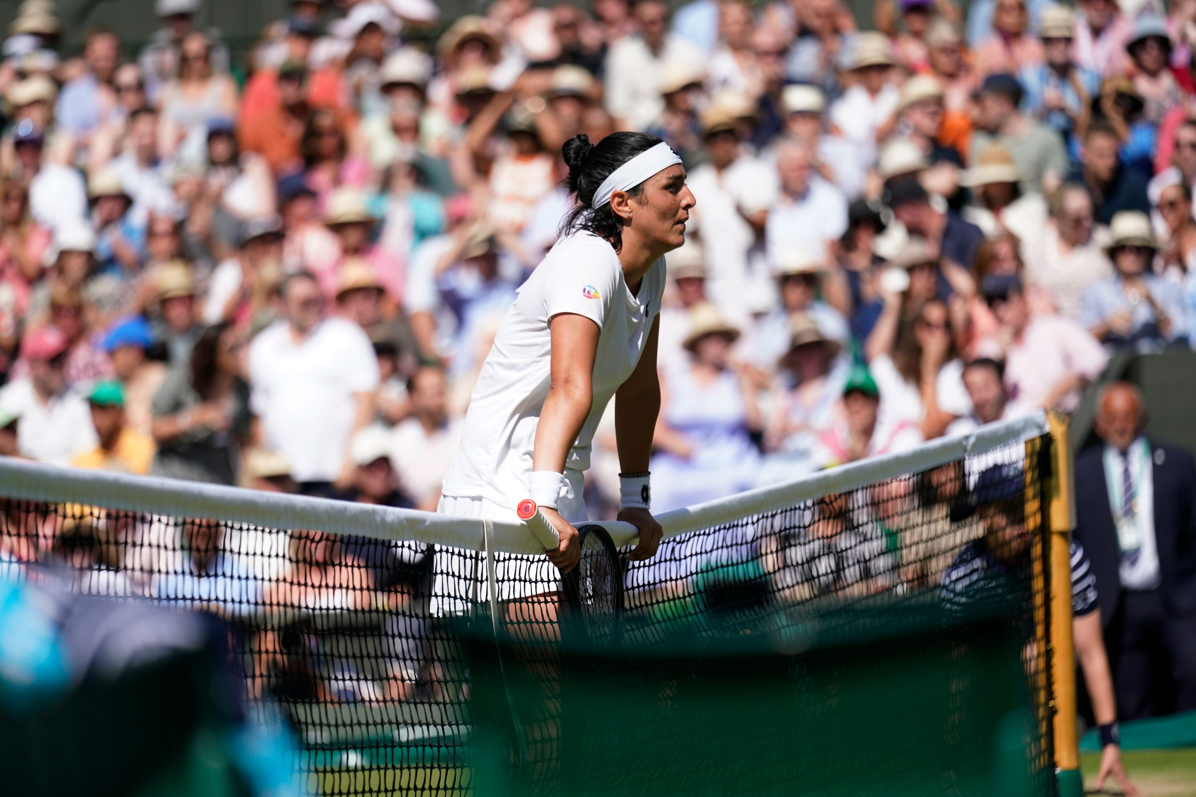 Tunisia's Ons Jabeur reacts after losing a point to Kazakhstan's Elena Rybakina in the final of the women's singles on day thirteen of the Wimbledon tennis championships in London, Saturday, July 9, 2022. (AP Photo/Gerald Herbert)