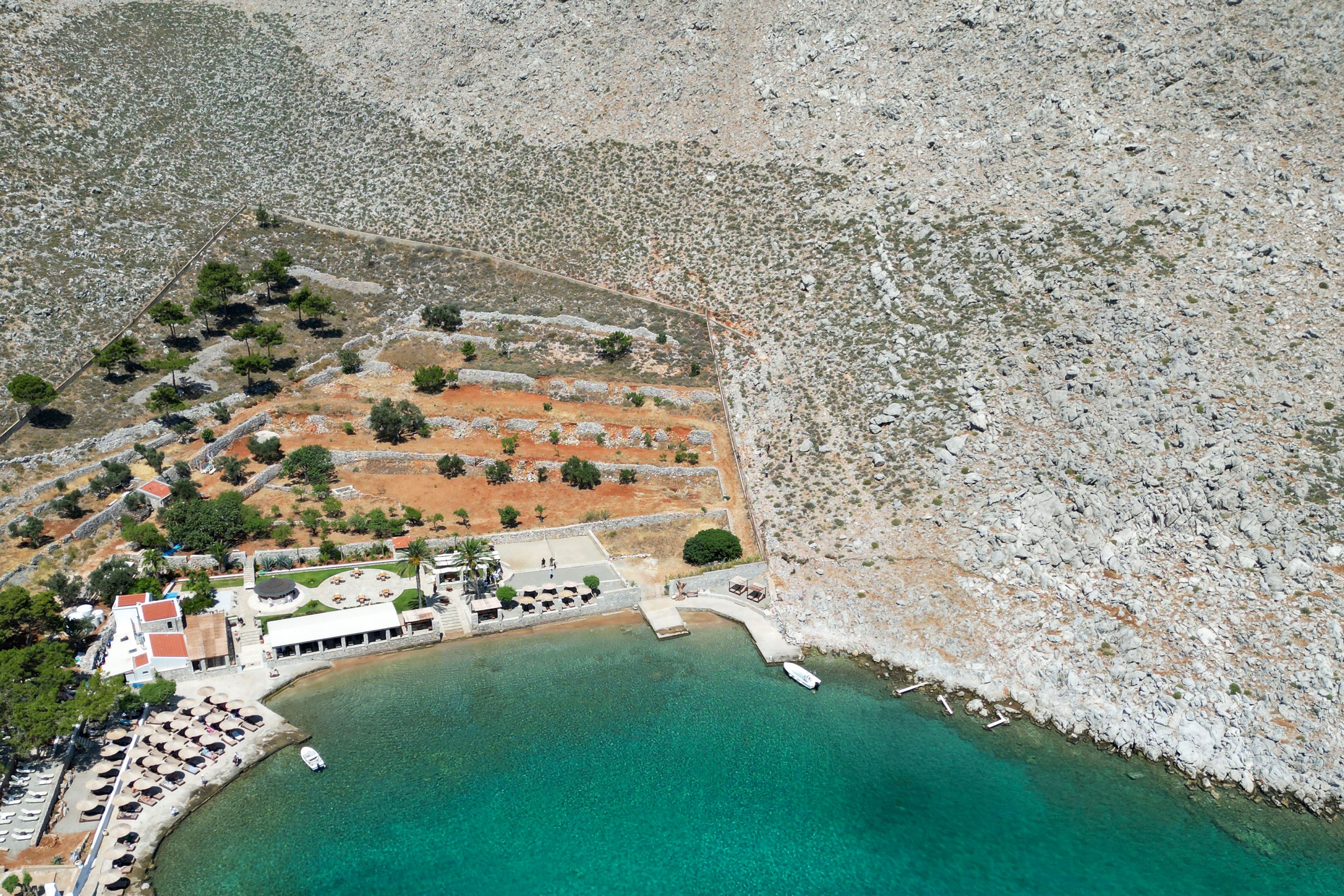 A general view of the area where the body of missing British TV presenter Michael Mosley was found, Sunday, June 9, 2024. The family of missing British TV presenter Dr. Michael Mosley have confirmed his body has been found on a Greek island. Mosley’s wife said Sunday in a statement that her husband had gone for a hike and took the wrong route and collapsed in a place where his body couldn’t easily be seen.