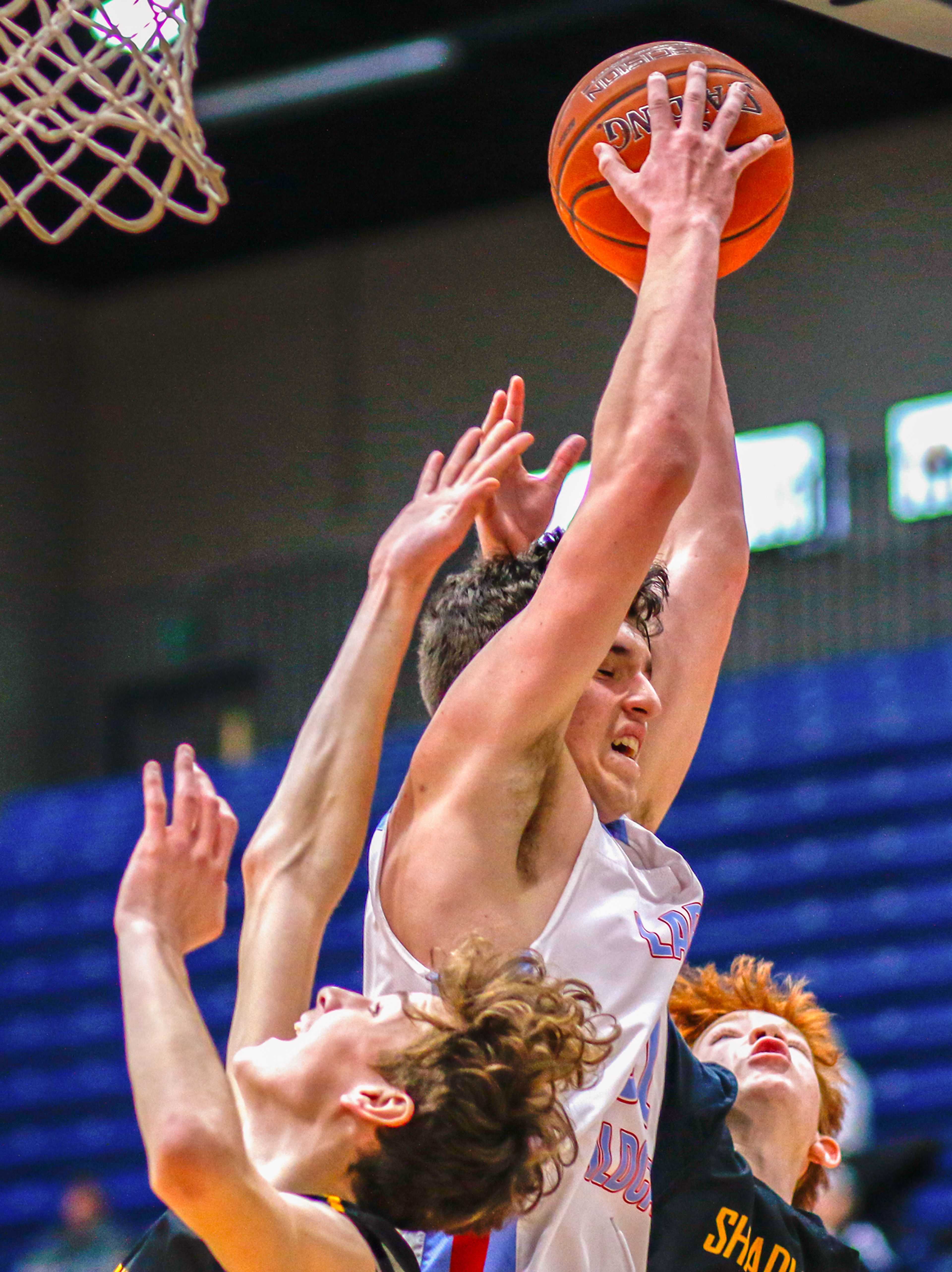 Lapwai guard Kase Wynott fights for an offensive rebound Thursday during the Avista Holiday Tournament boys basketball final against Shadle Park at the P1FCU Activity Center in Lewiston.