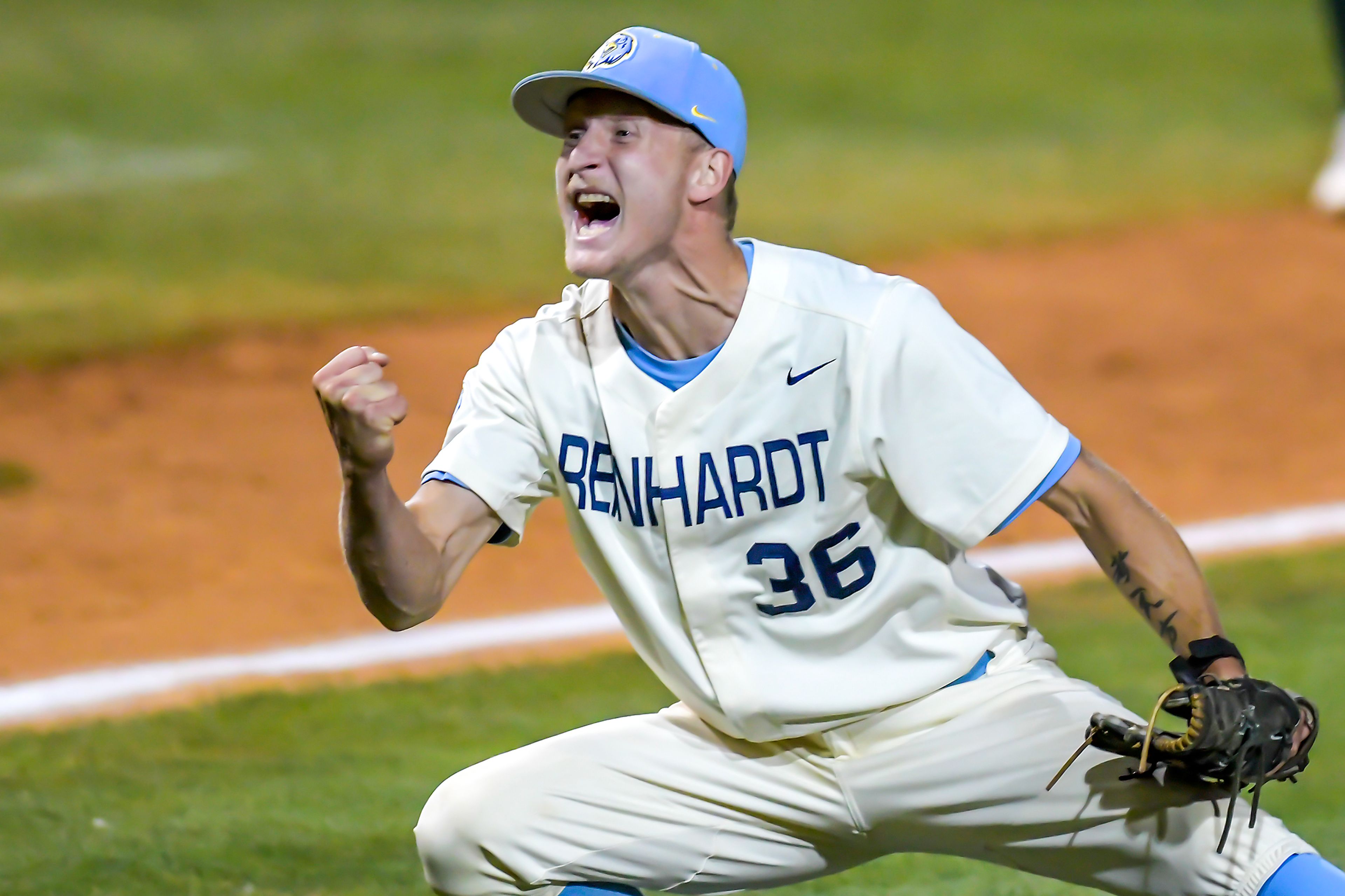 Reinhardt pitcher Brett Allen celebrates defeating Georgia Gwinnett in Game 15 of the NAIA World Series at Harris Field Tuesday in Lewiston.