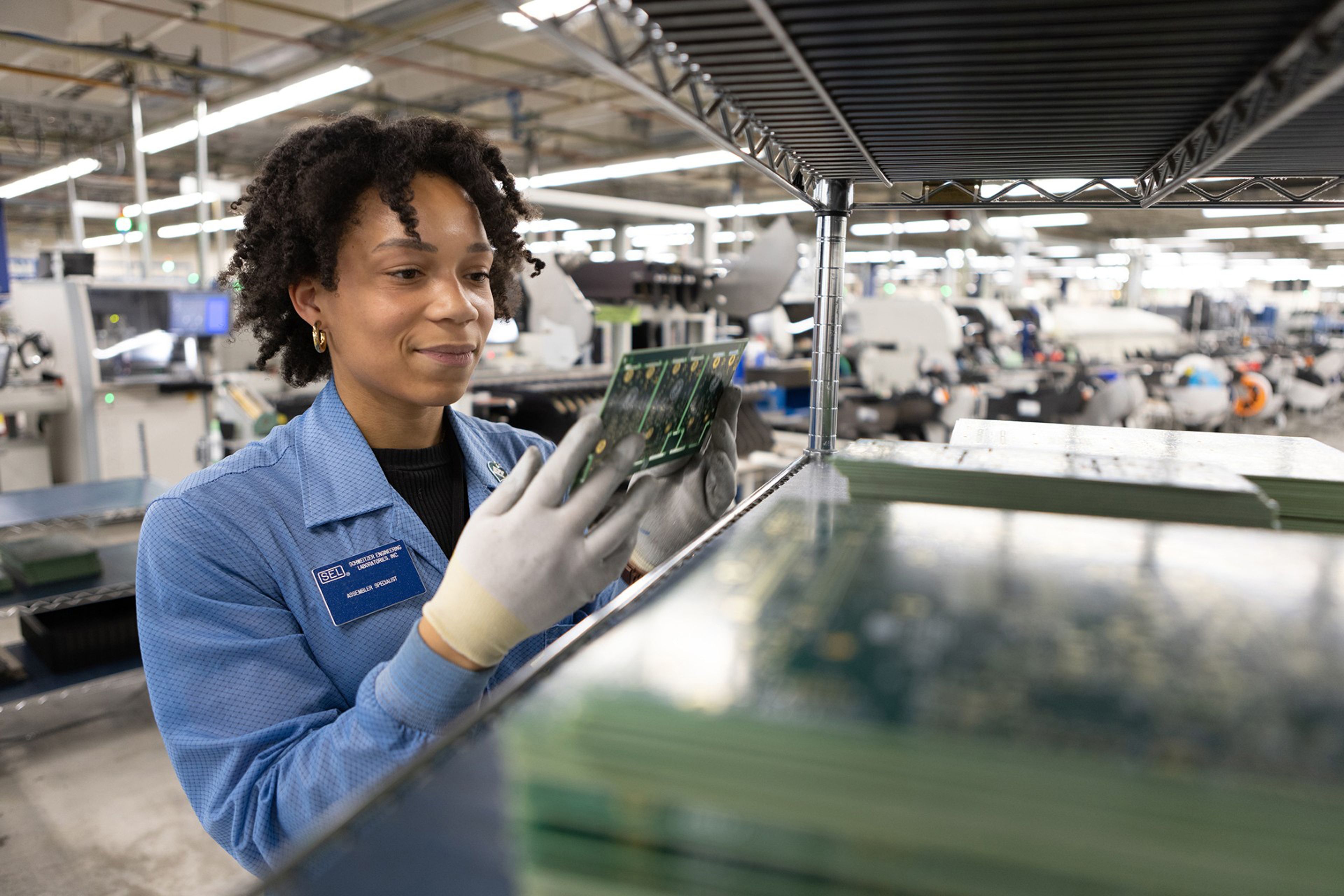 A process engineering technician works in one of the two Schweitzer Engineering Laboratories manufacturing facilities on its Pullman campus.