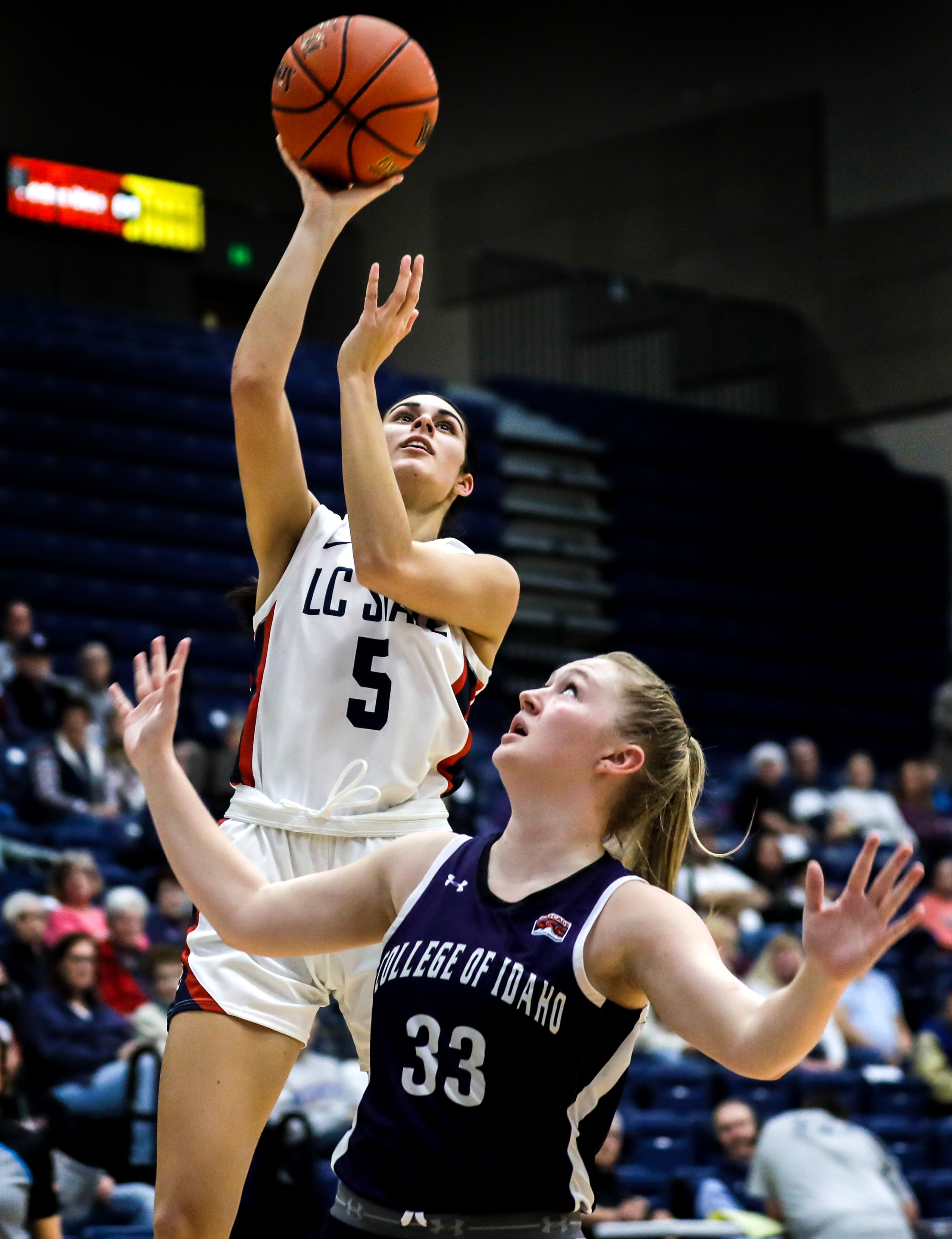 Lewis-Clark State forward Sitara Byrd shoots a layup as College of Idaho guard Mia Austin guards her in a Cascade Conference game Feb. 2 in Lewiston.