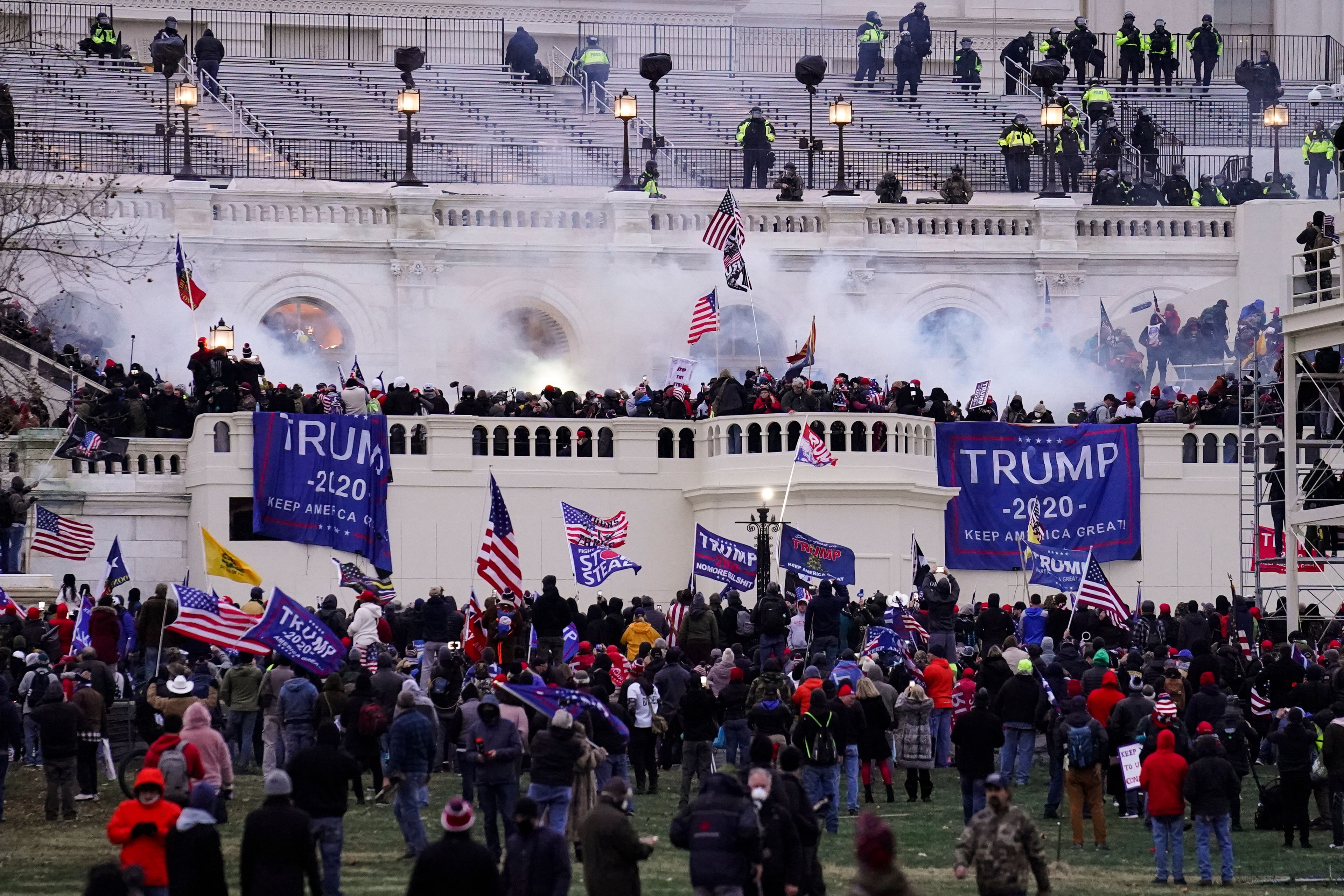 FILE - Violent protesters, loyal to President Donald Trump, storm the Capitol, Wednesday, Jan. 6, 2021, in Washington. (AP Photo/John Minchillo, File)