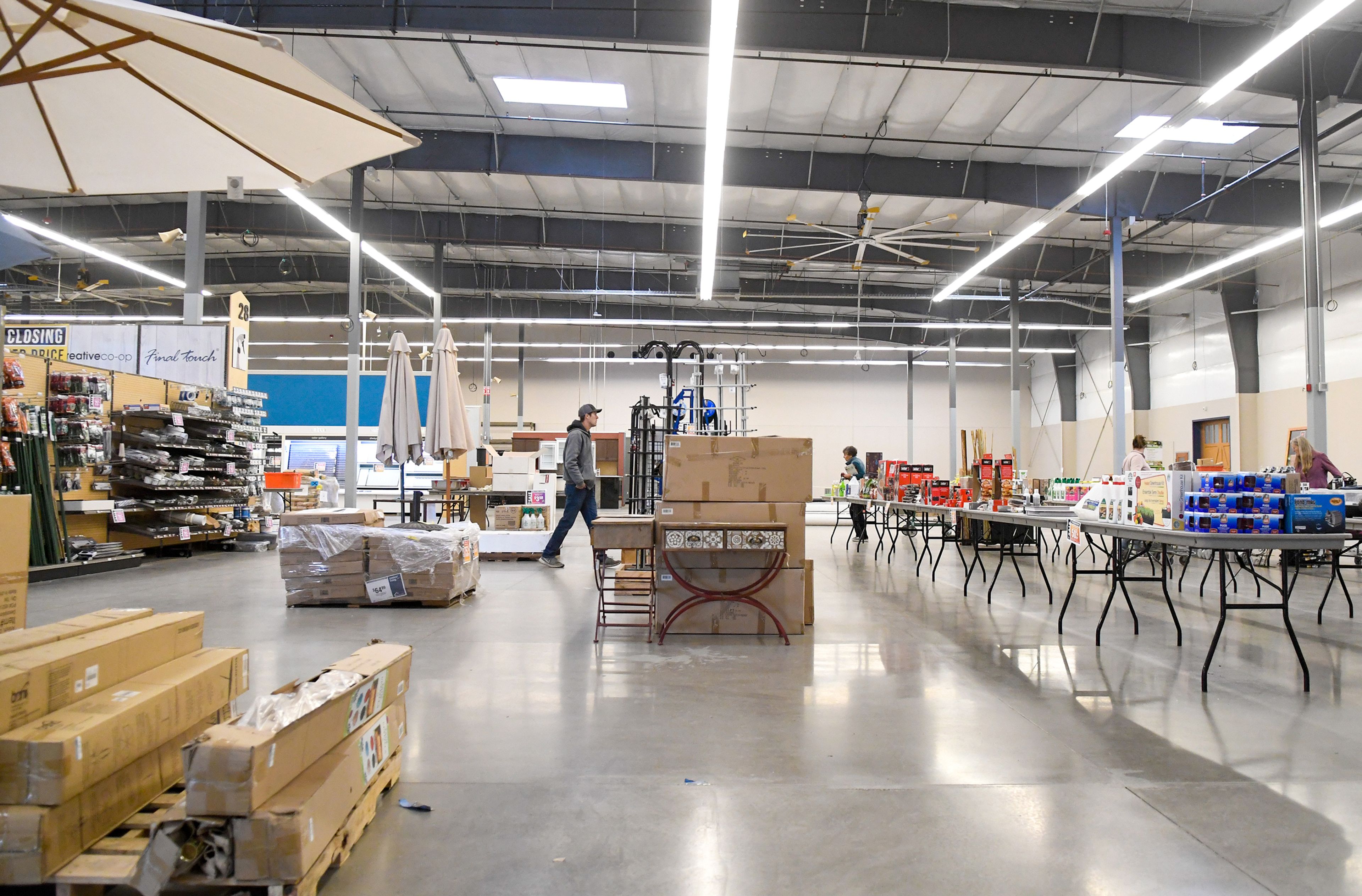 Shoppers look through liquidation sales Wednesday at Pullman Building Supply in Pullman.