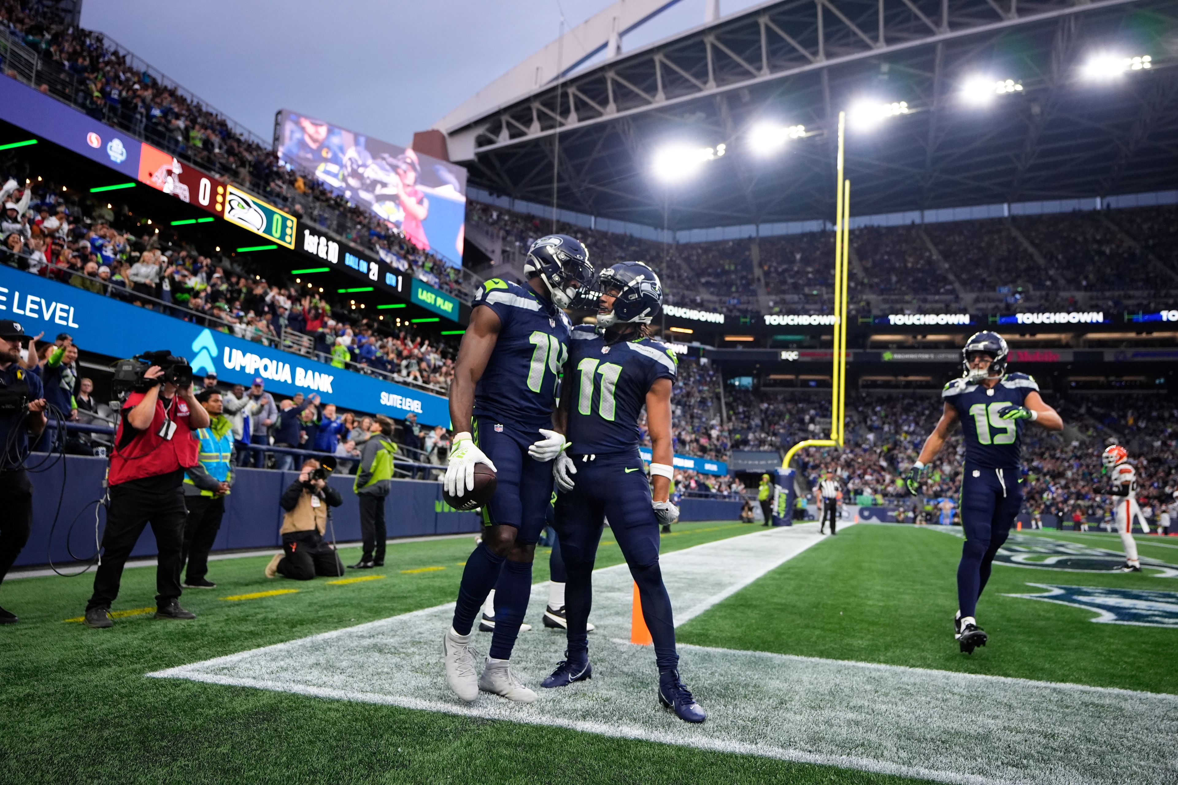 Seattle Seahawks wide receiver Jaxon Smith-Njigba (11) celebrates with wide receiver DK Metcalf (14) after Metcalf scored a touchdown during a preseason NFL football game against the Cleveland Browns, Saturday, Aug. 24, 2024, in Seattle. (AP Photo/Lindsey Wasson)