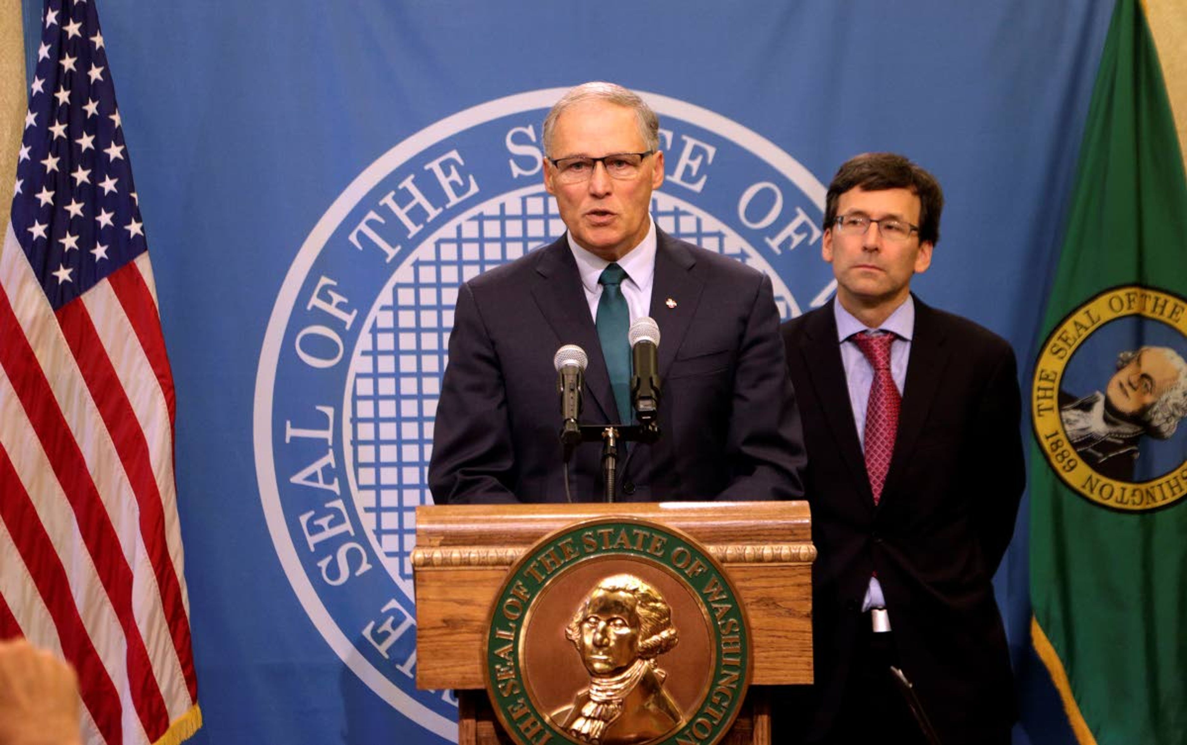 Gov. Jay Inslee, left, addresses a news conference with Attorney General Bob Ferguson following an earlier announcement that Washington's Supreme Court unanimously struck down the state's death penalty, Thursday, Oct. 11, 2018, in Olympia, Wash. Washington has had a moratorium on executions since 2014, but the ruling makes it the 20th state to do away with capital punishment by legislative act or court decree. The court converted the sentences of the eight people on Washington's death row to life in prison. (AP Photo/Rachel La Corte)