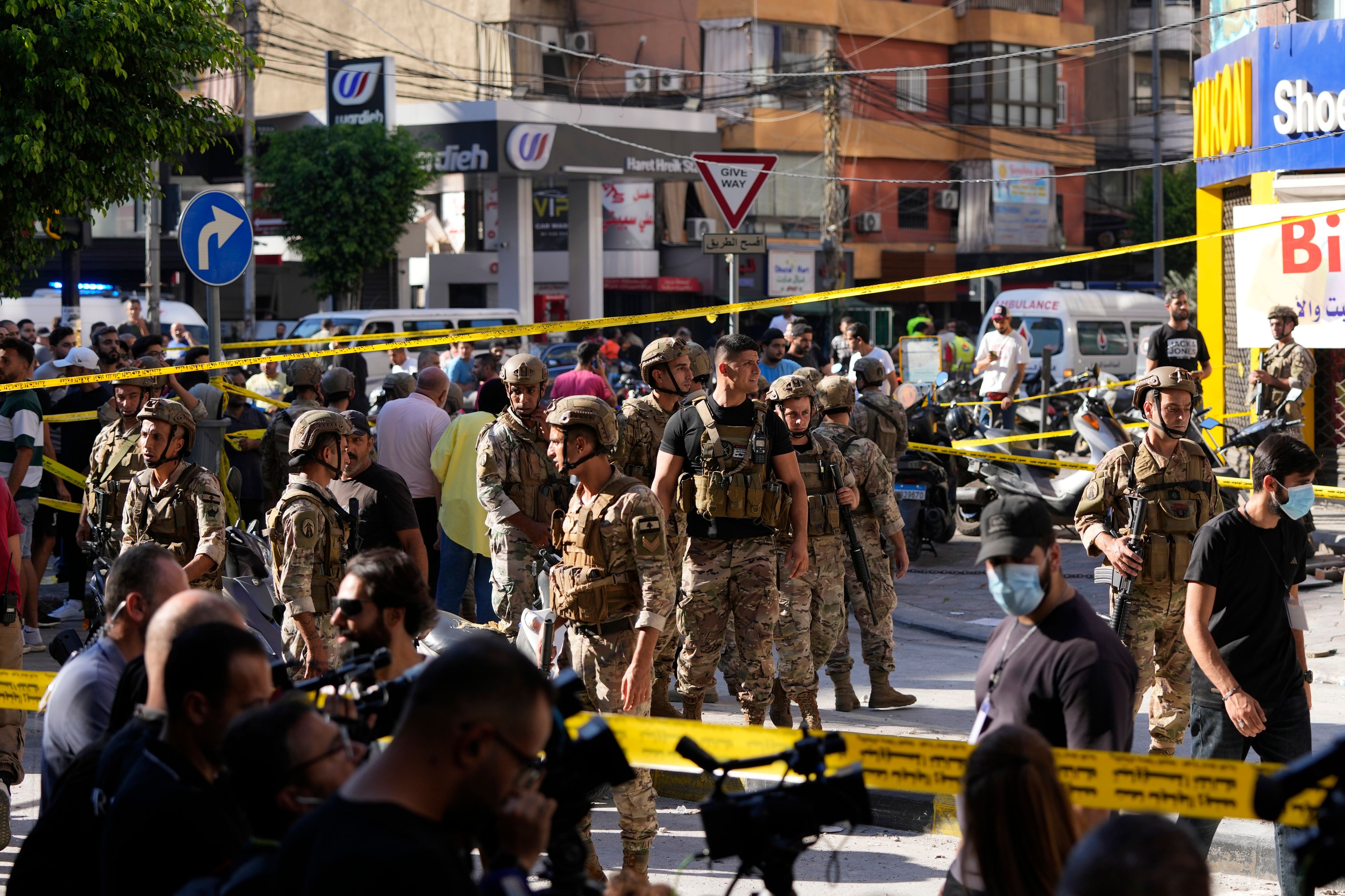 Lebanese soldiers cordon off the area at the site of an Israeli airstrike in Beirut's southern suburbs, Thursday, Sept. 26, 2024. (AP Photo/Hassan Ammar)