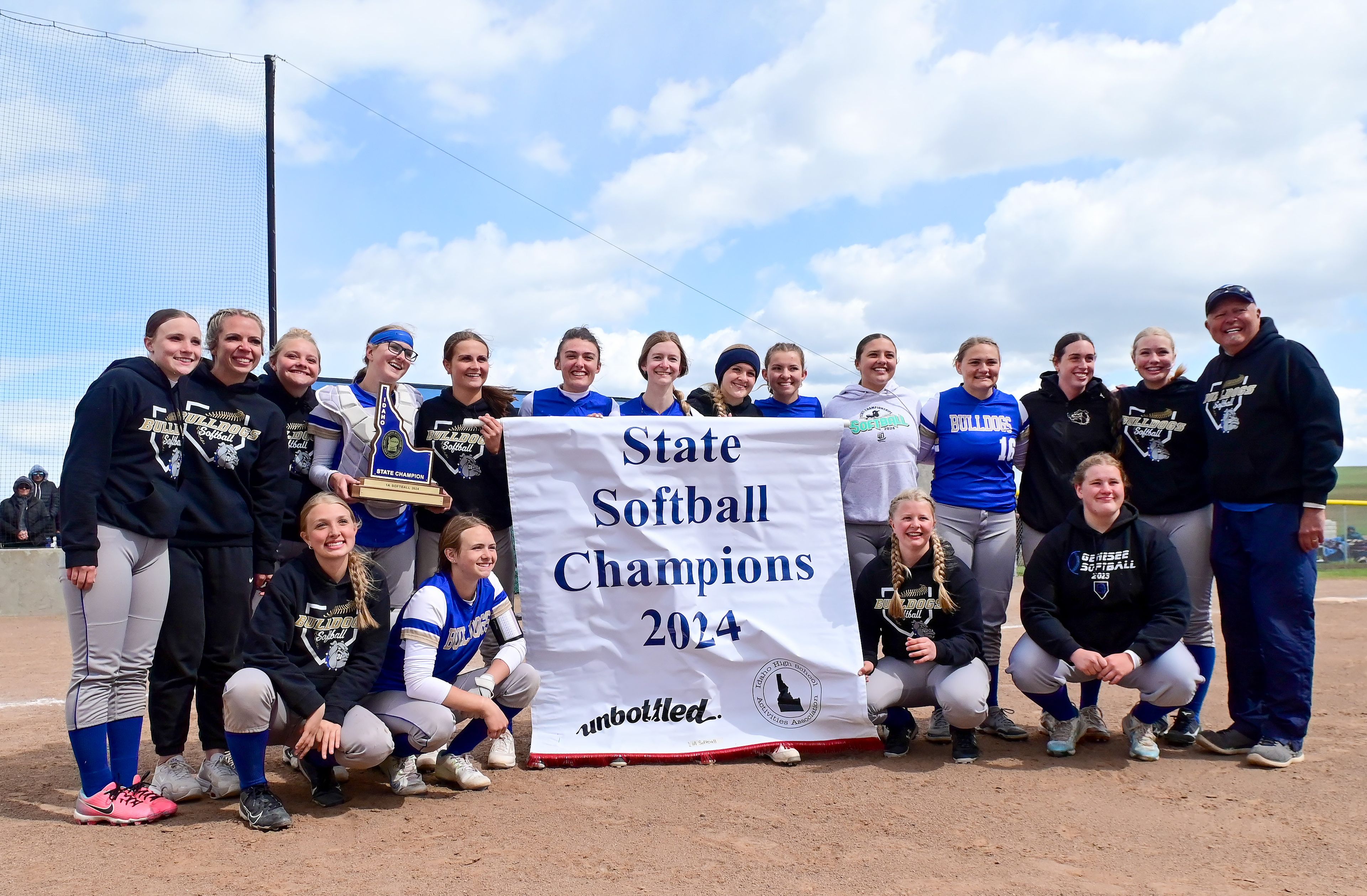 Genesee’s softball team gathers for a group photo after being crowned the Idaho Class 1A state softball champions May 17 in Genesee.