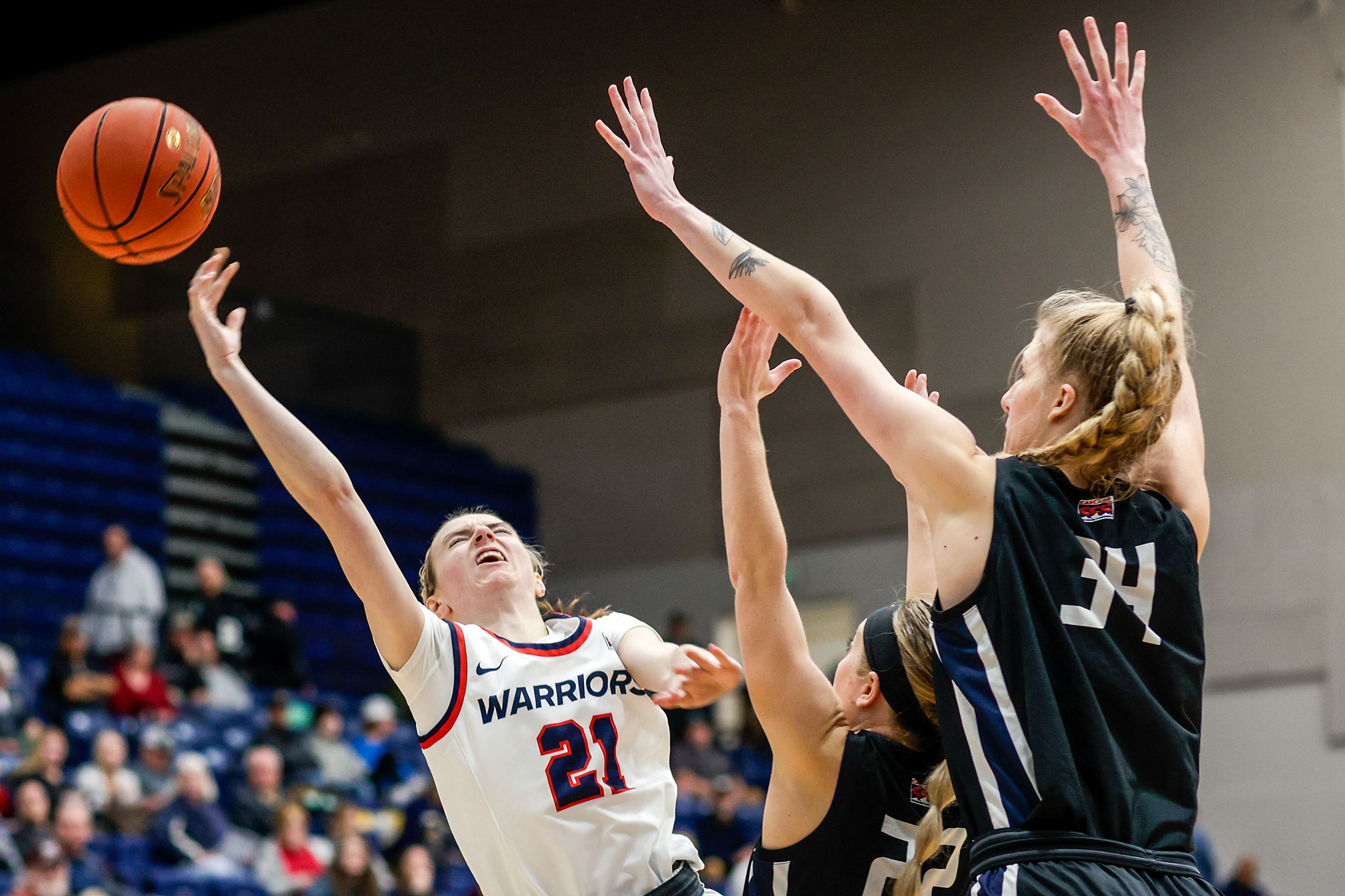 Lewis-Clark State guard Callie Stevens, left, loses the ball attempting a shot as Eastern Oregon guard Sailor Liefke, center, and forward Shaelie Burgess defend during a Cascade Conference game Friday at Lewis-Clark State College.