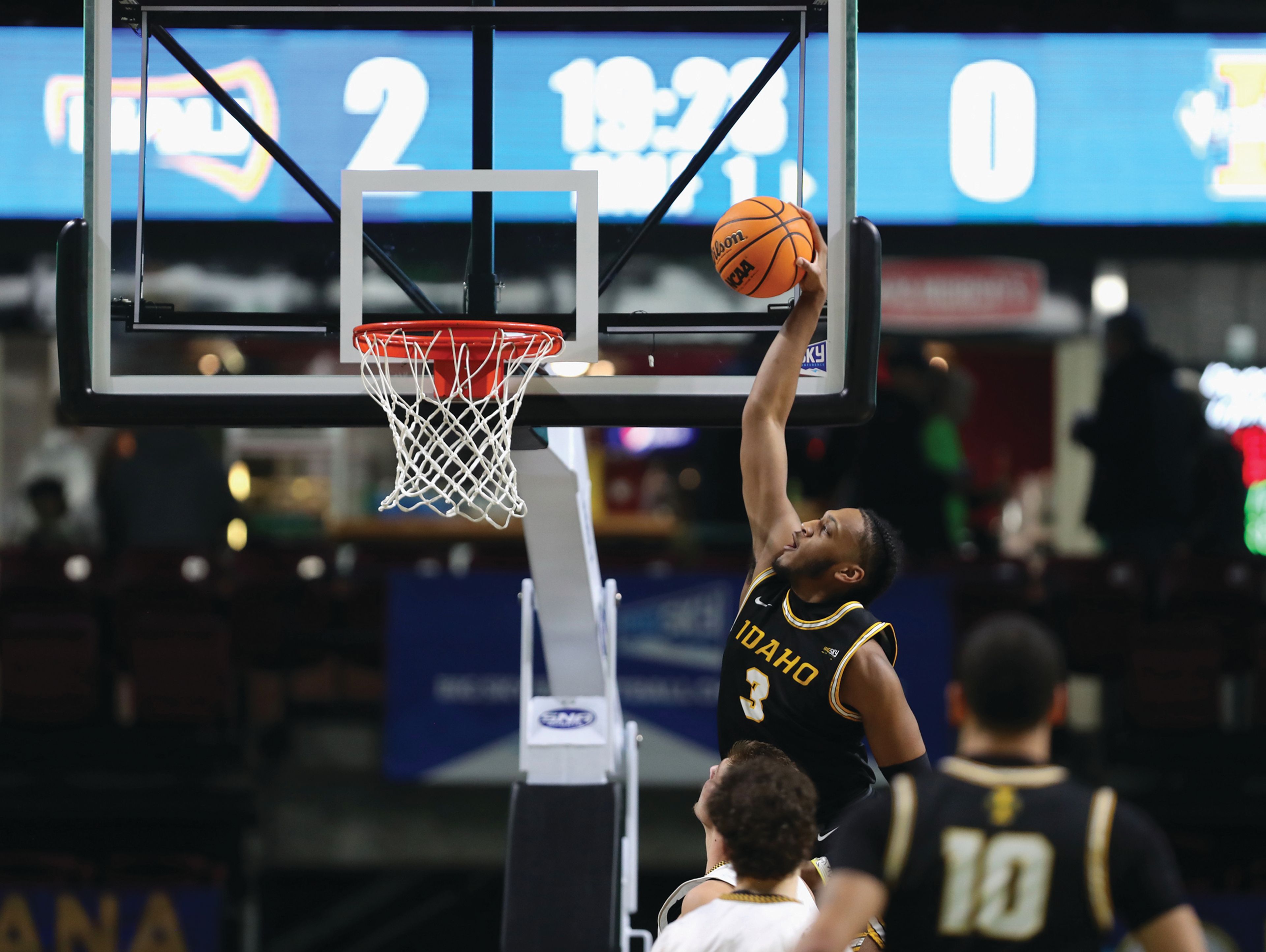 Idaho junior forward Isaac Jones dunks during the first half of a Big Sky men's basketball first-round tournament game Saturday against Northern Arizona at Idaho Central Arena in Boise.