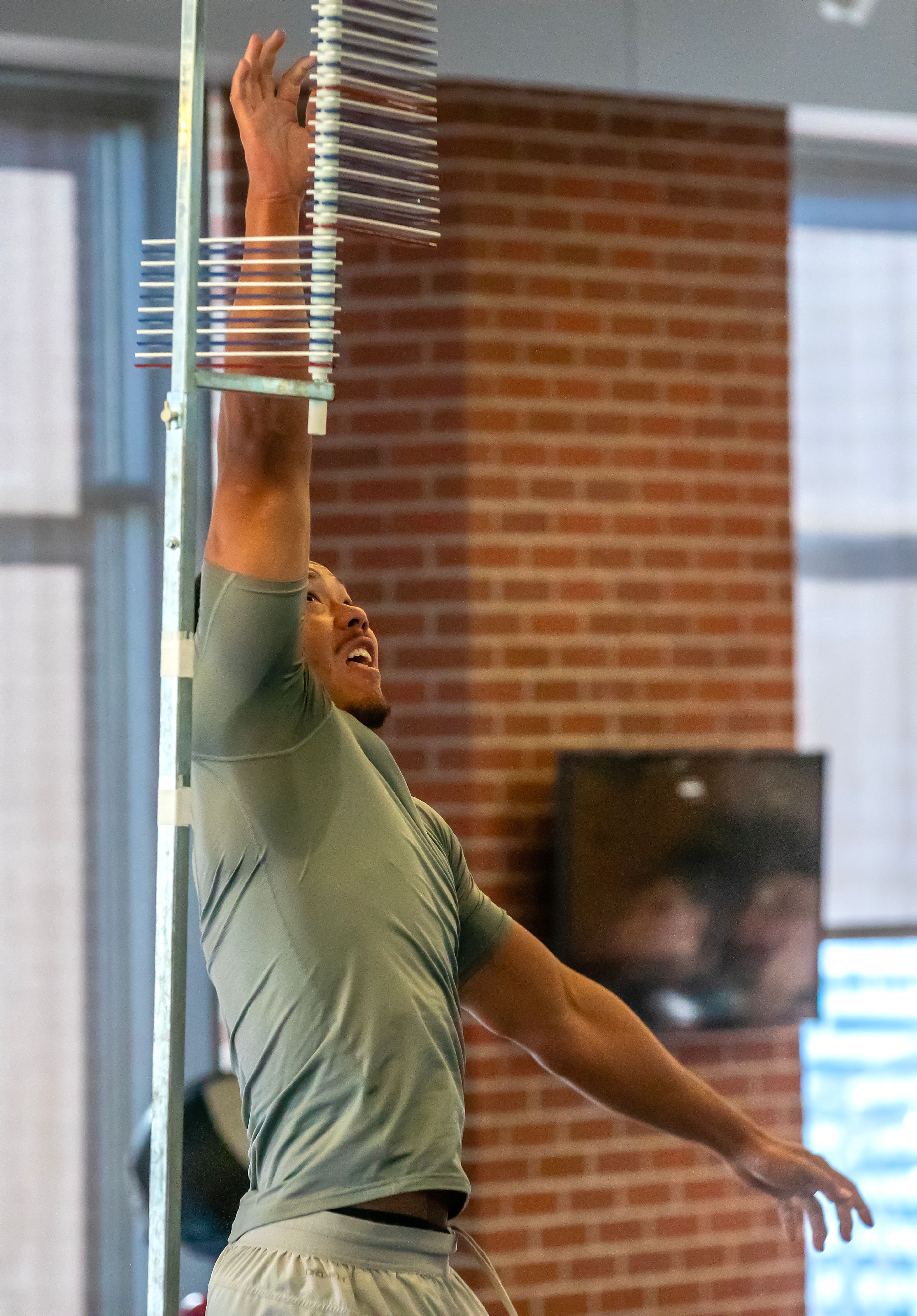Washington State safety Tanner Moku leaps up for his vertical jump test during WSU's Pro Day on Friday in Pullman.