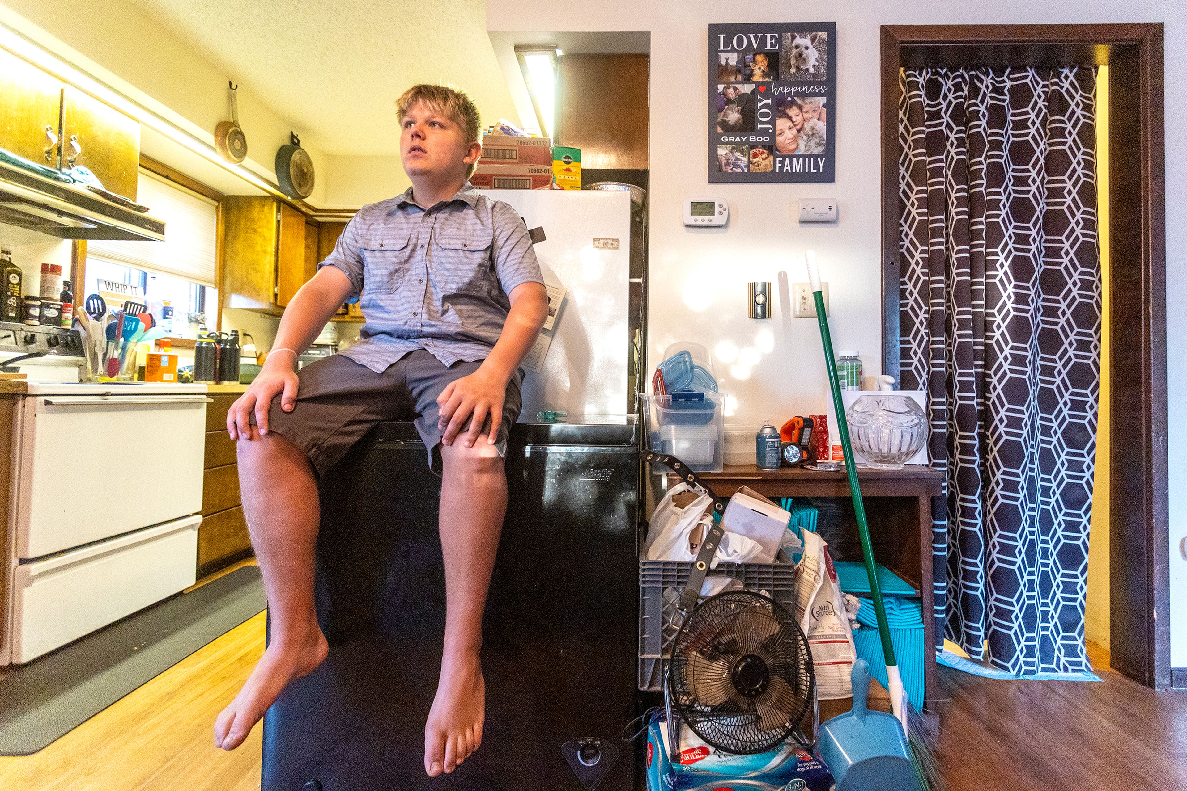 Tony Poulsen talks to his mother before heading to the Moscow High School football game on Friday.