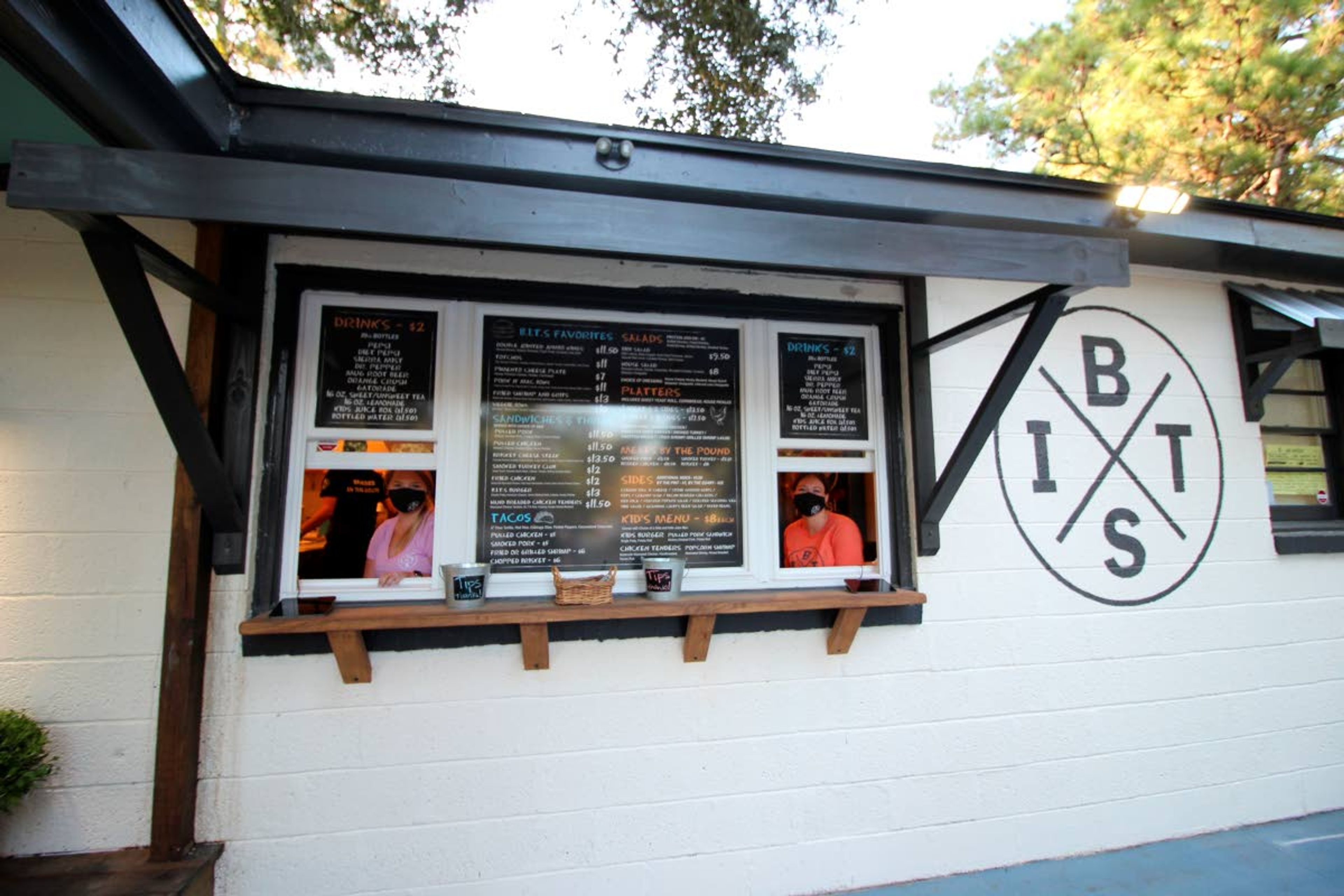 This photo provided by Hannah Albert on Sept. 23, 2020 shows workers at Braised in the South, a Johns Island, S.C., restaurant and food truck business that is having trouble finding workers during the pandemic. Many small businesses find hiring more difficult because many would-be staffers fear contracting COVID-19 on the job or would prefer to live off unemployment benefits. (Hannah Albert via AP)