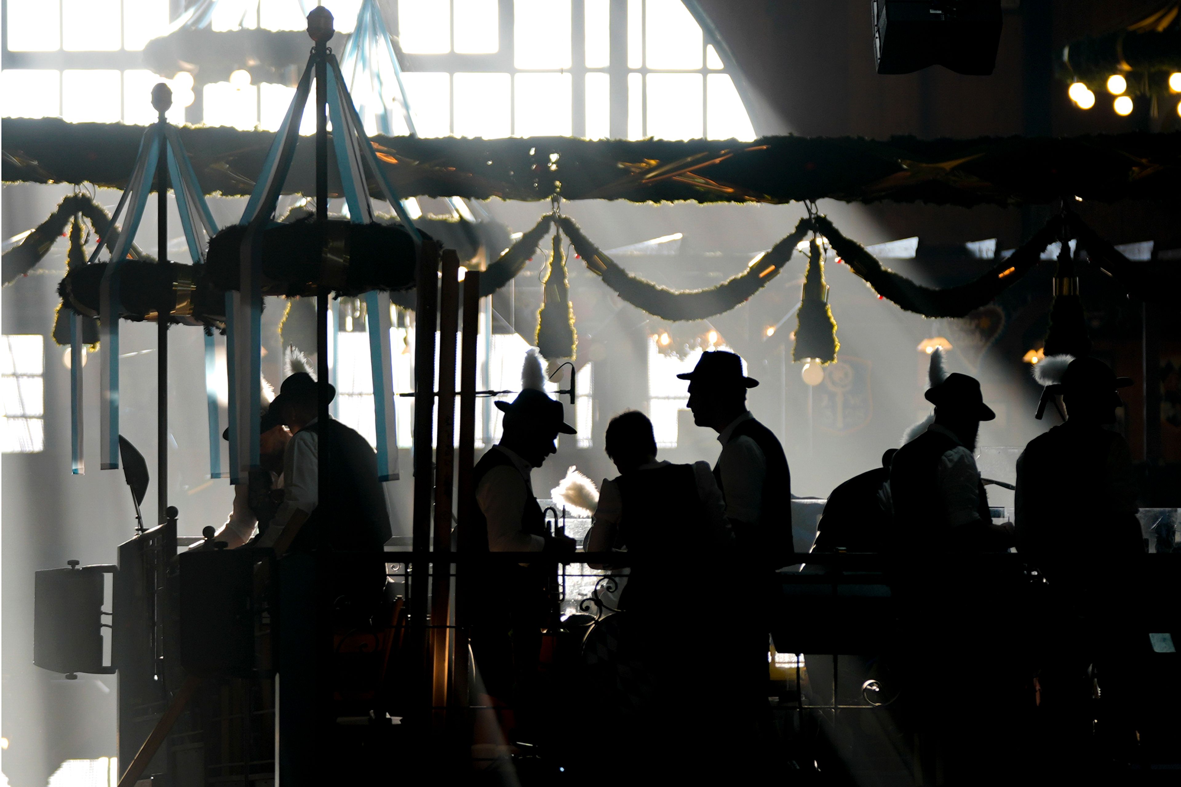 Bavarian musicians prepare in the Augustiner marquee for the start of the 189th 'Oktoberfest' beer festival in Munich, Germany, Saturday morning, Sept. 21, 2024. (AP Photo/Matthias Schrader),