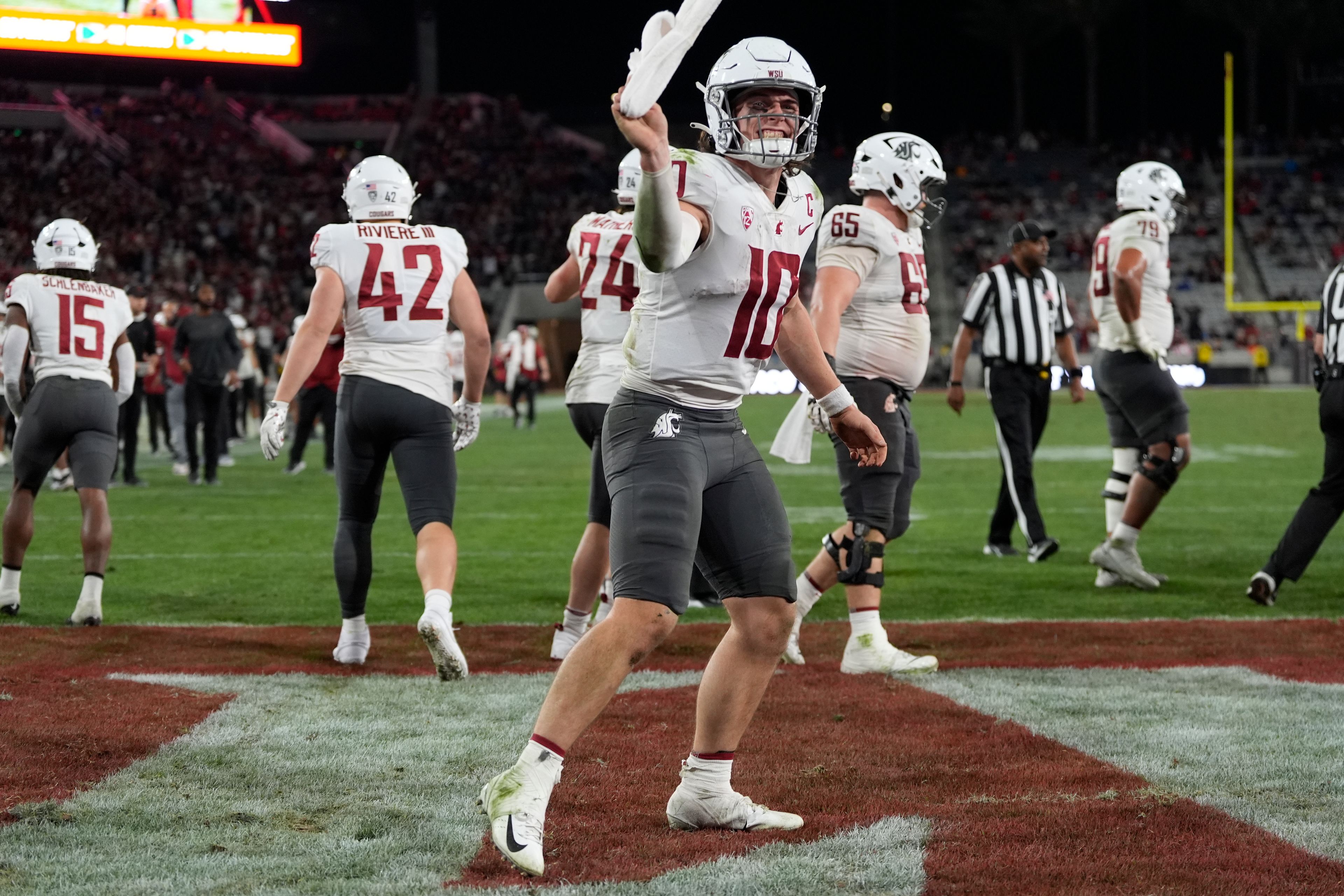 Washington State quarterback John Mateer (10) celebrates a touchdown during the second half of an NCAA college football game against San Diego State Saturday, Oct. 26, 2024, in San Diego. (AP Photo/Gregory Bull)