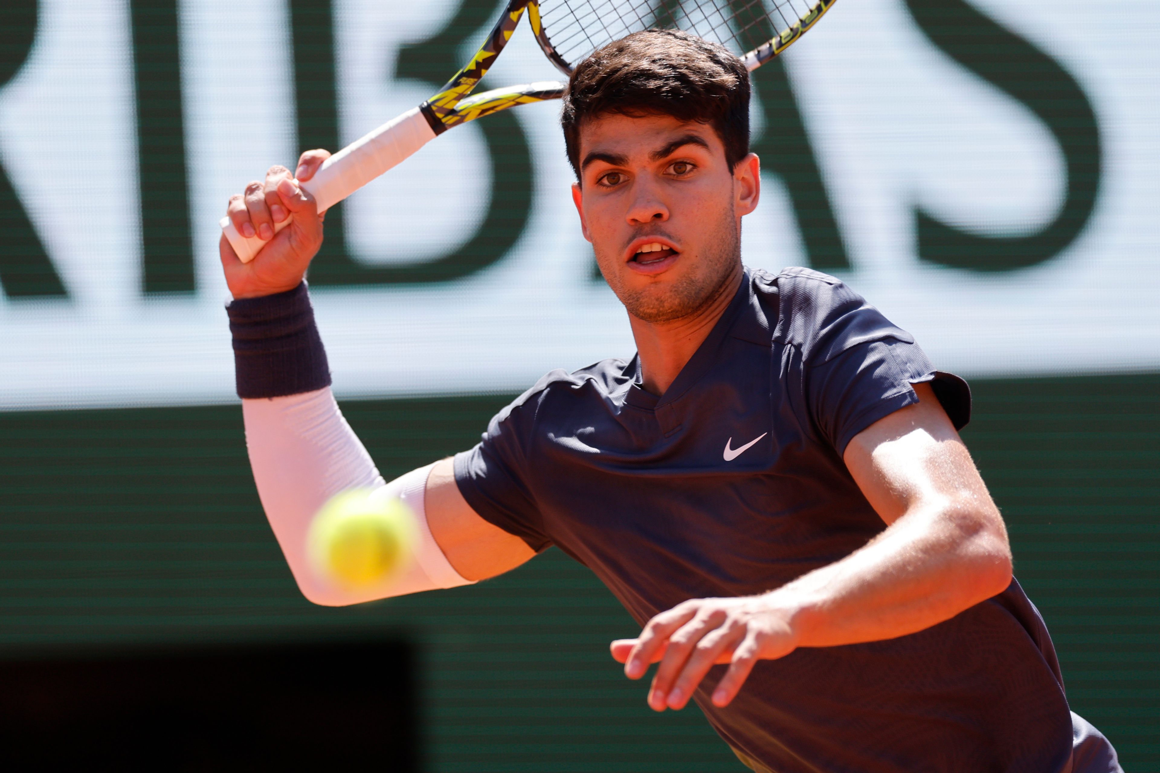 Spain's Carlos Alcaraz plays a shot against Italy's Jannik Sinner during their semifinal match of the French Open tennis tournament at the Roland Garros stadium in Paris, Friday, June 7, 2024.