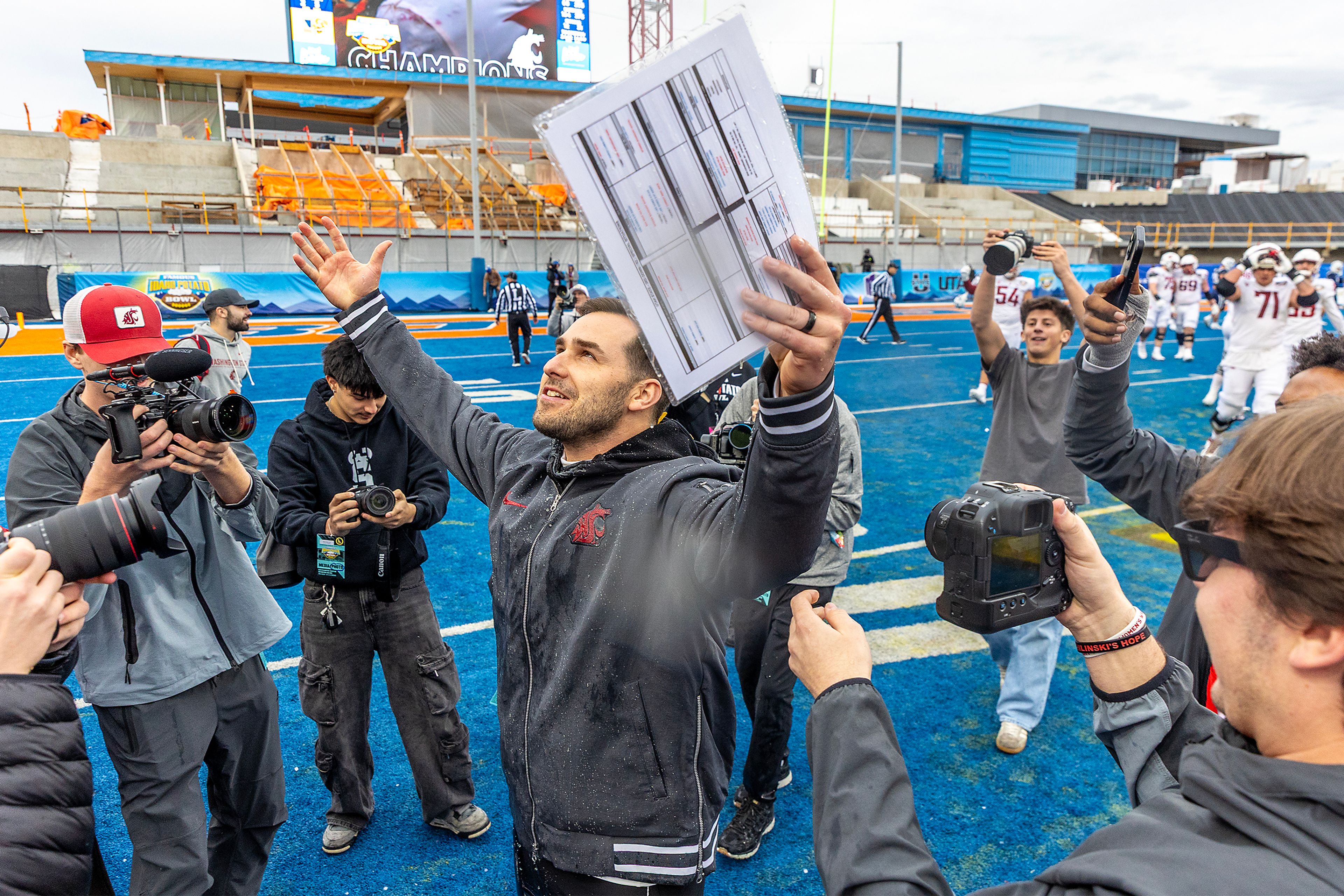 Washington State Interim Head Coach Jesse Bobbit reacts as the Cougars leafed Utah State during the Famous Idaho Potato Bowl Monday at Albertsons Stadium in Boise. Washington State defeated Utah State 34-21.